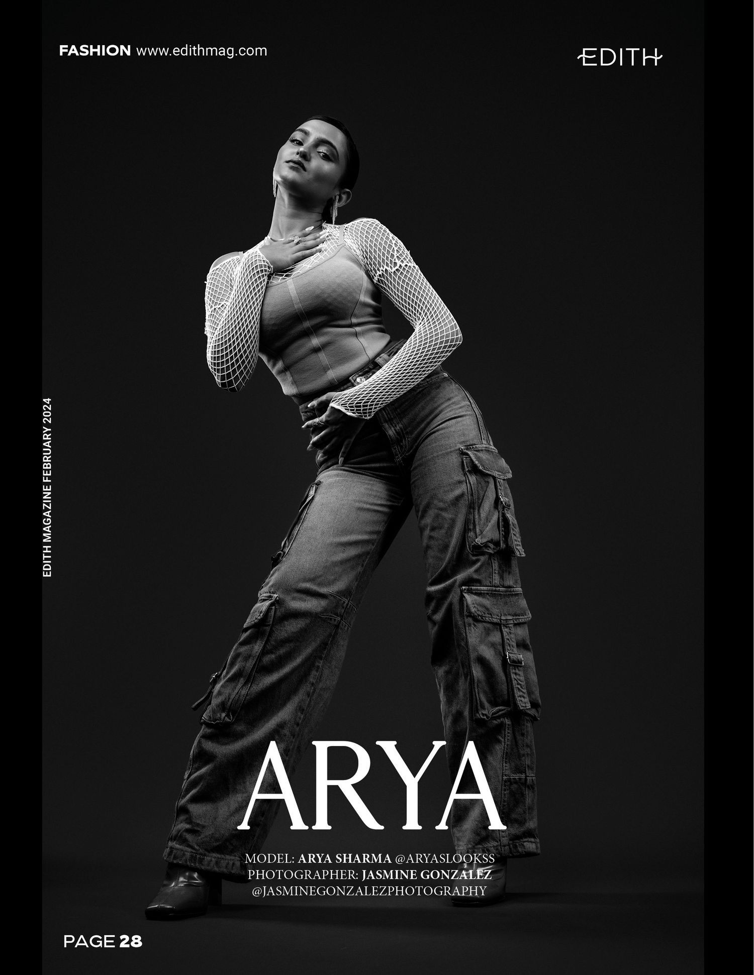 Black and white fashion editorial photo showing dramatic pose in urban streetwear against dark background.