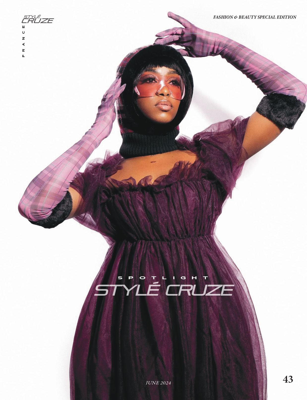 Model wearing purple dress and long gloves poses elegantly for Style Cruze magazine cover.