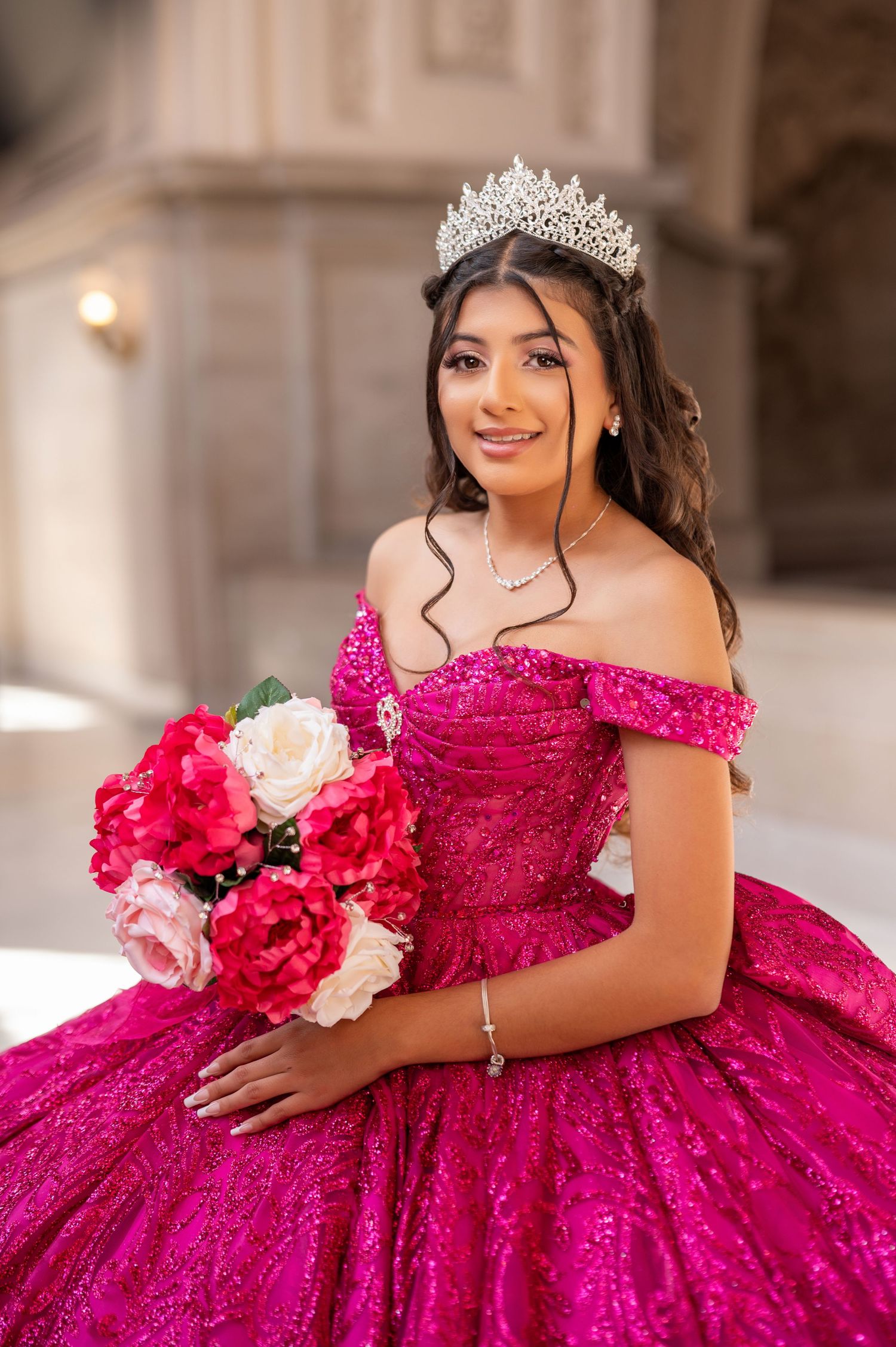Classic quinceañera portrait in pink gown holding bouquet inside San Francisco City Hall | The Padillas