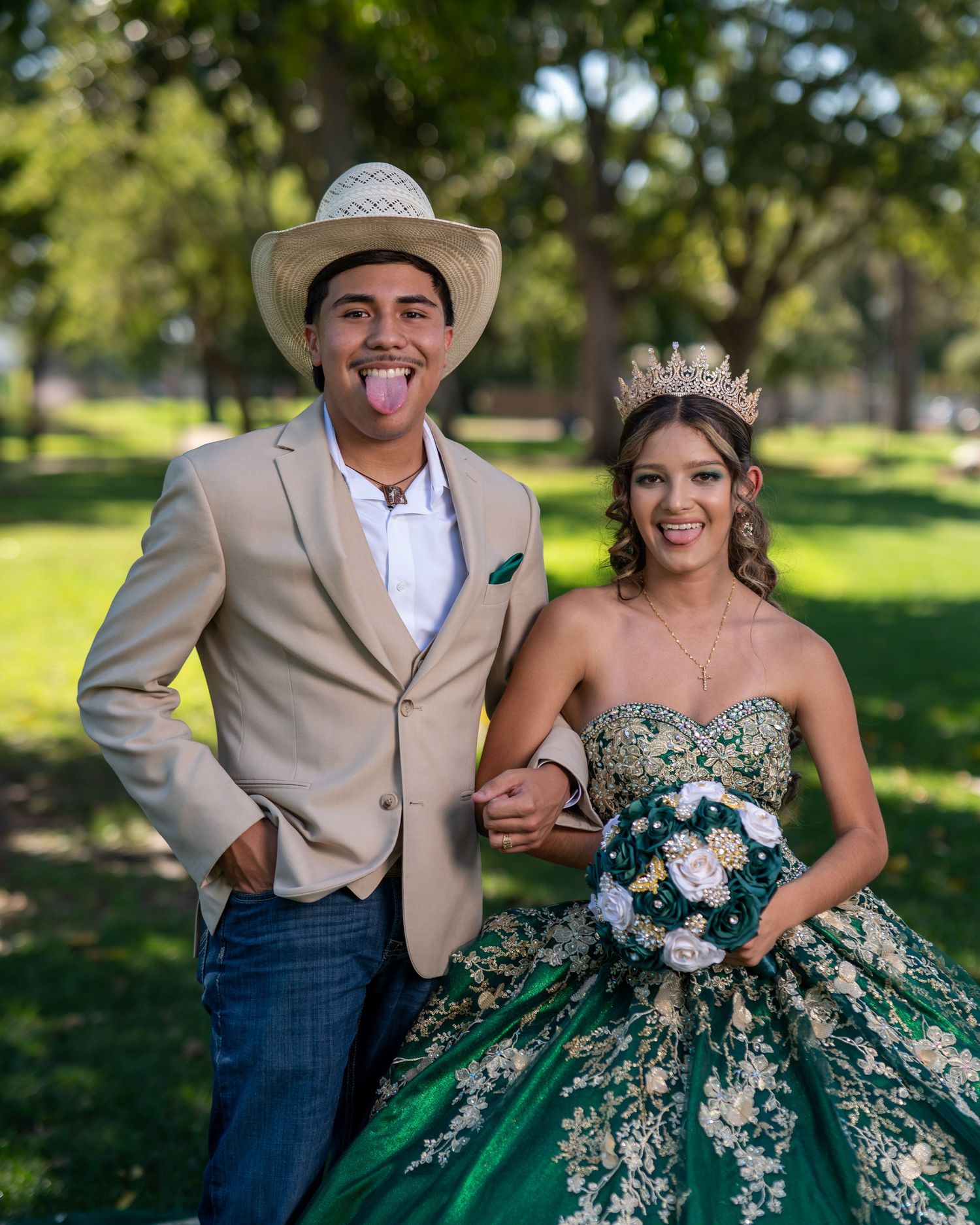 Quinceañera couple outdoor portrait in cowboy hat and green gold dress Lodi Lake