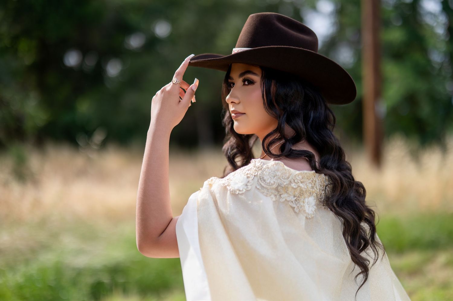 Cowgirl quinceañera portrait at Gibson Ranch Sacramento, outdoor western quince photoshoot