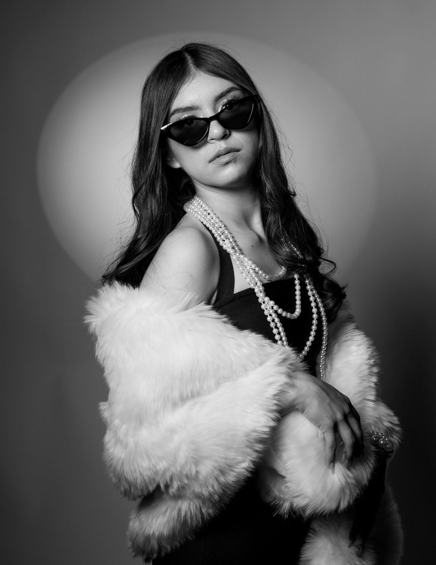 Black and white studio quinceañera portrait with fur coat and pearls, Stockton photoshoot | The Padillas