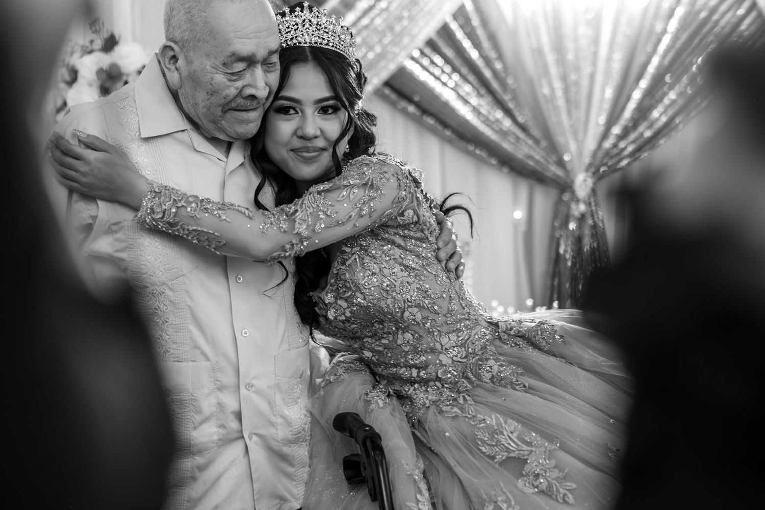 Emotional Quinceañera Hug with Grandfather at Sacramento Reception