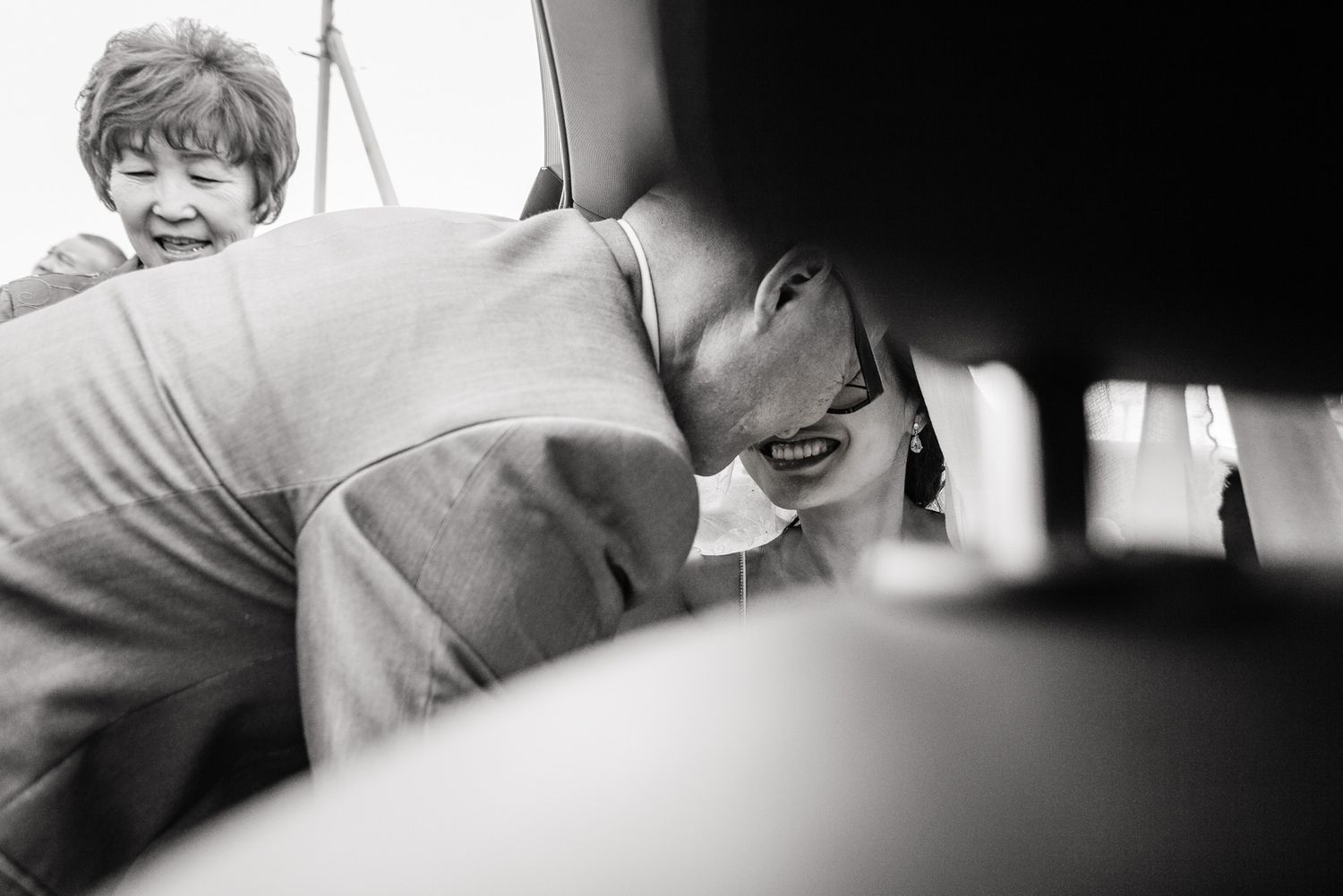 Dramatic low-light black and white photographs capturing intimate wedding day moments.