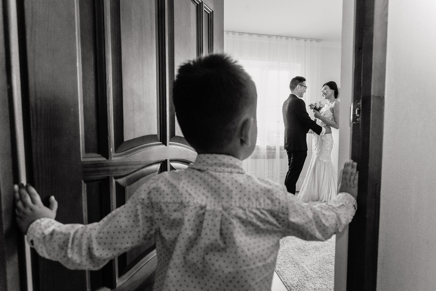 A series of candid moments captured in black and white showing wedding day preparations.