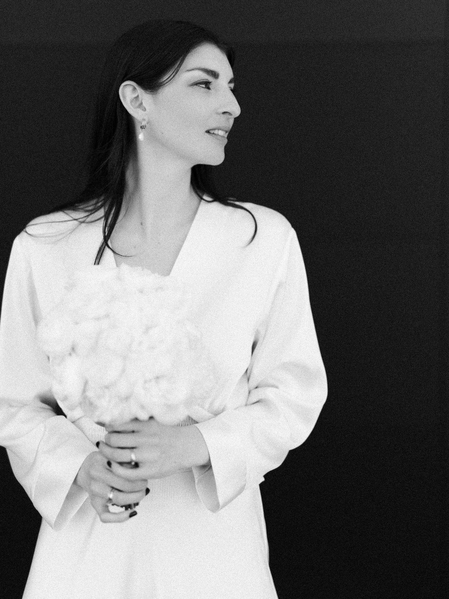 Series of expressive bride portraits in white dress against black backdrop.