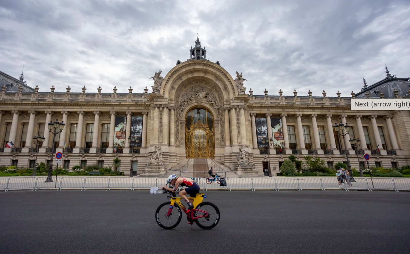 Artistic panorama of the Louvre Museum facade in Paris showcasing its ornate classical architecture under dramatic clouds.
