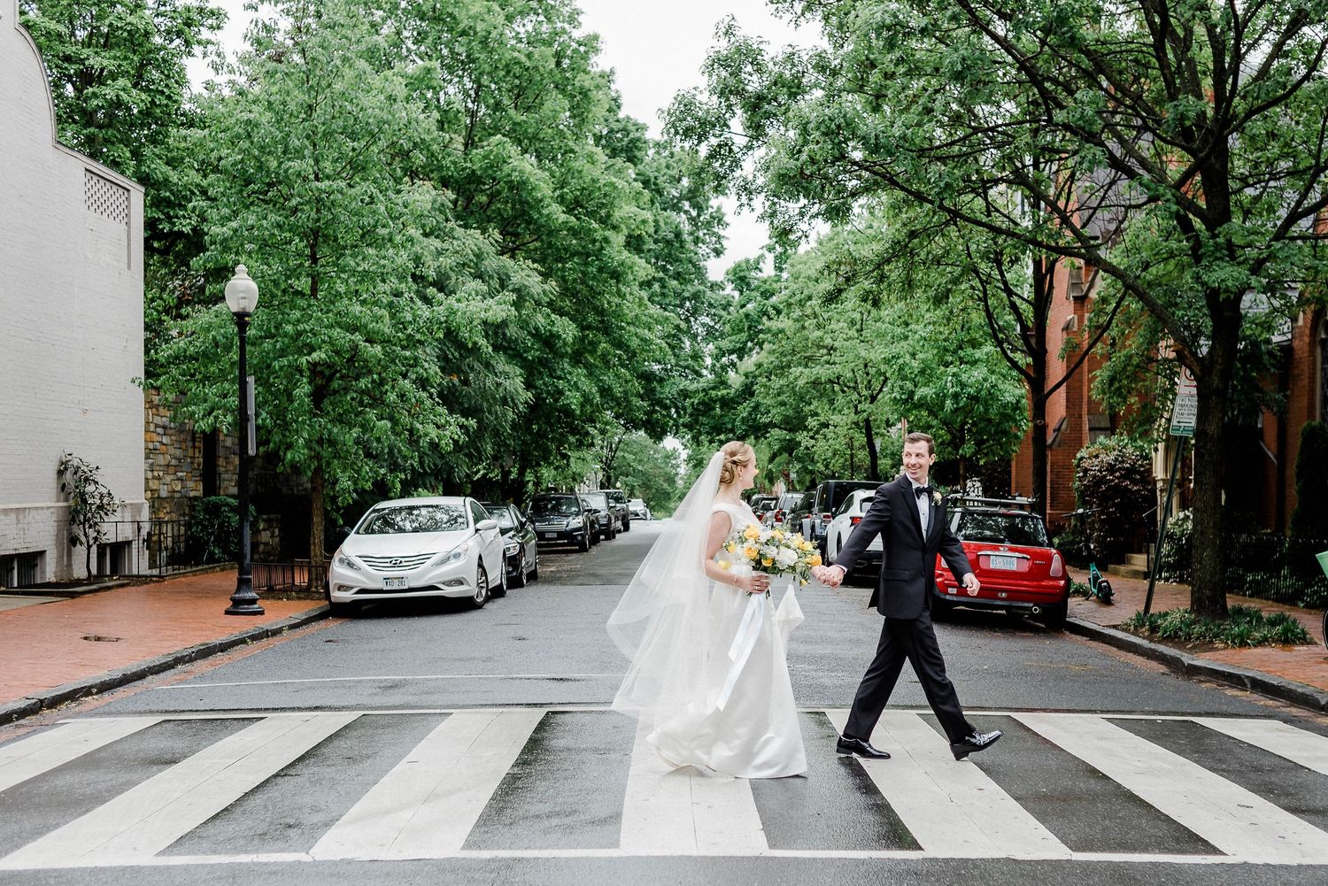 bride-groom-walking-across-classic-sidewalk