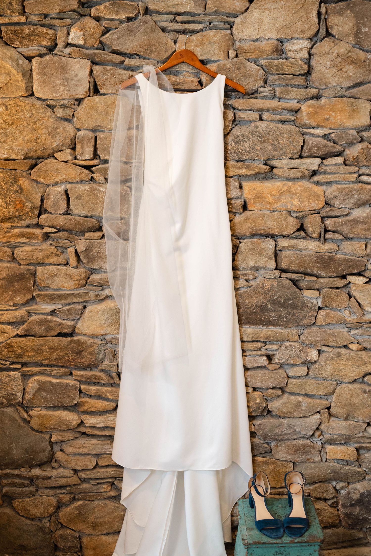 The brides gown with blue heels and veil