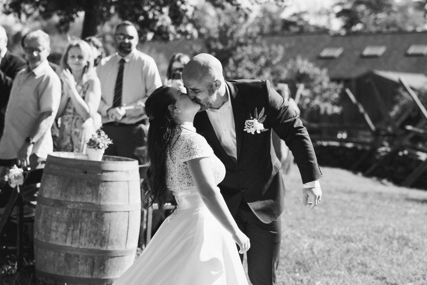 first-kiss-Bull-Run-Winery-outdoor-wedding