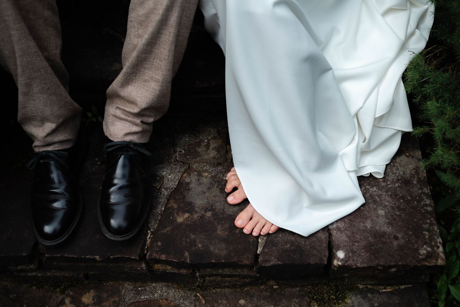bride-and-grooms-bare-feet-stone-steps