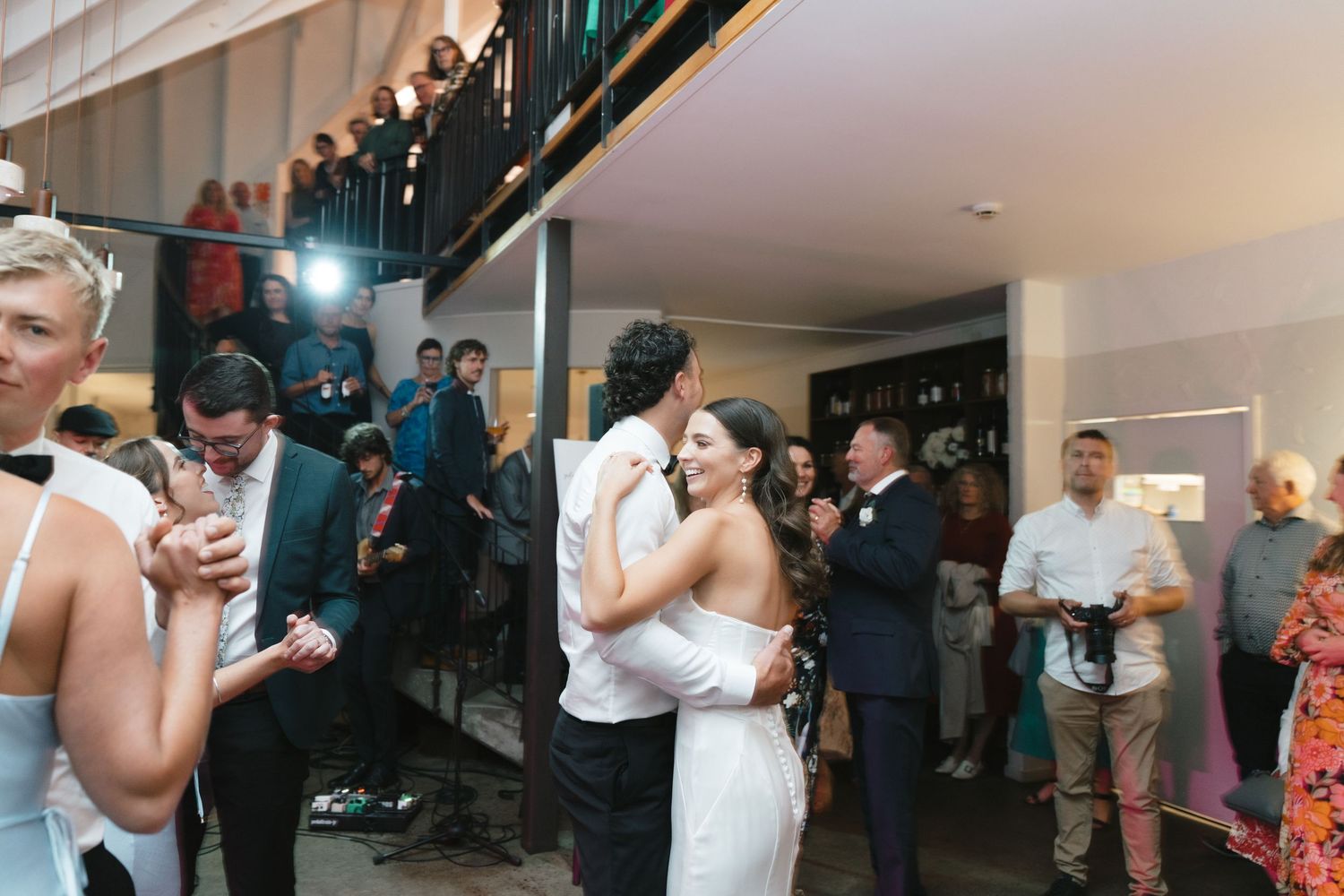Wedding reception dance floor filled with guests enjoying the celebration.