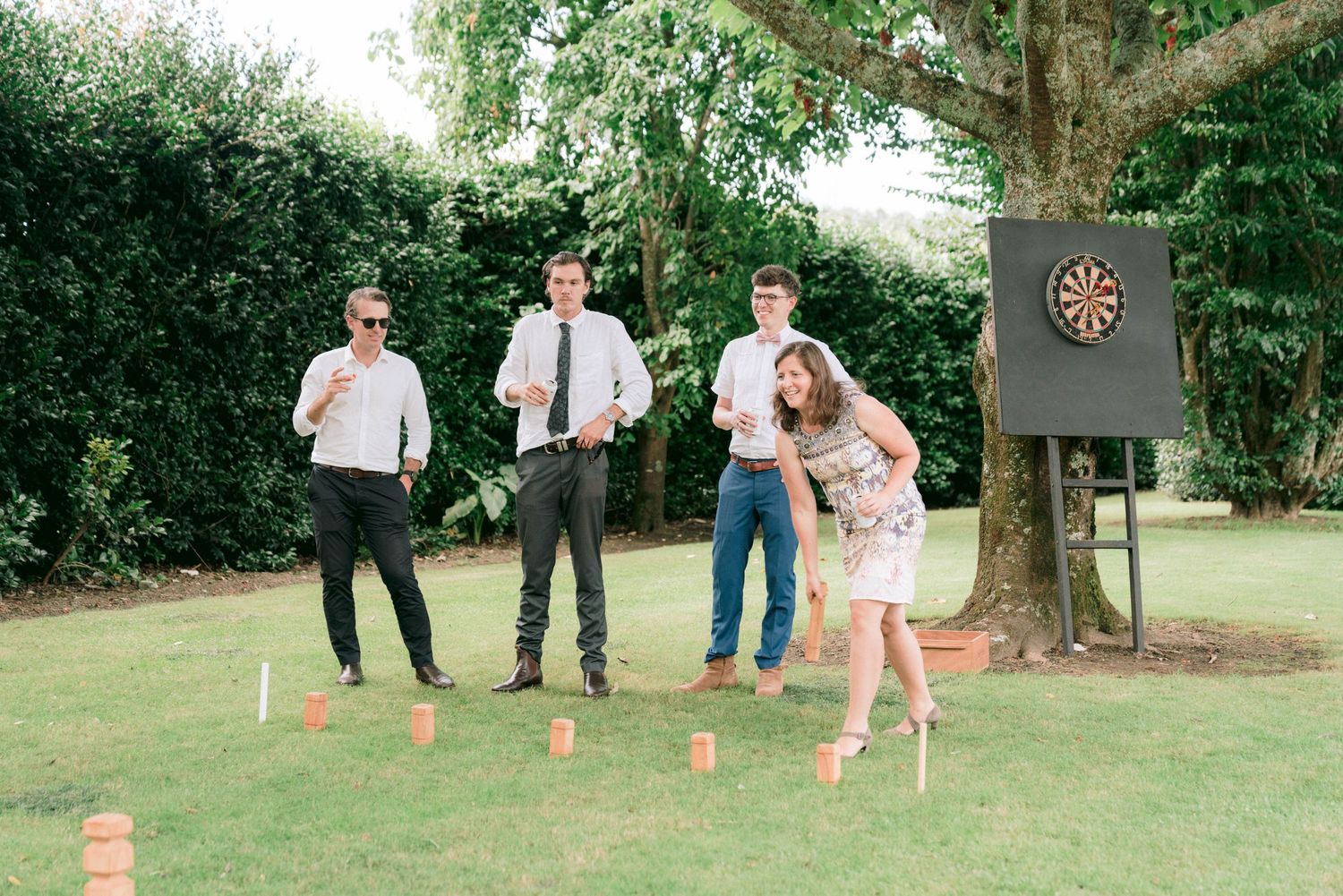 Outdoor lawn games set up at a garden wedding reception.