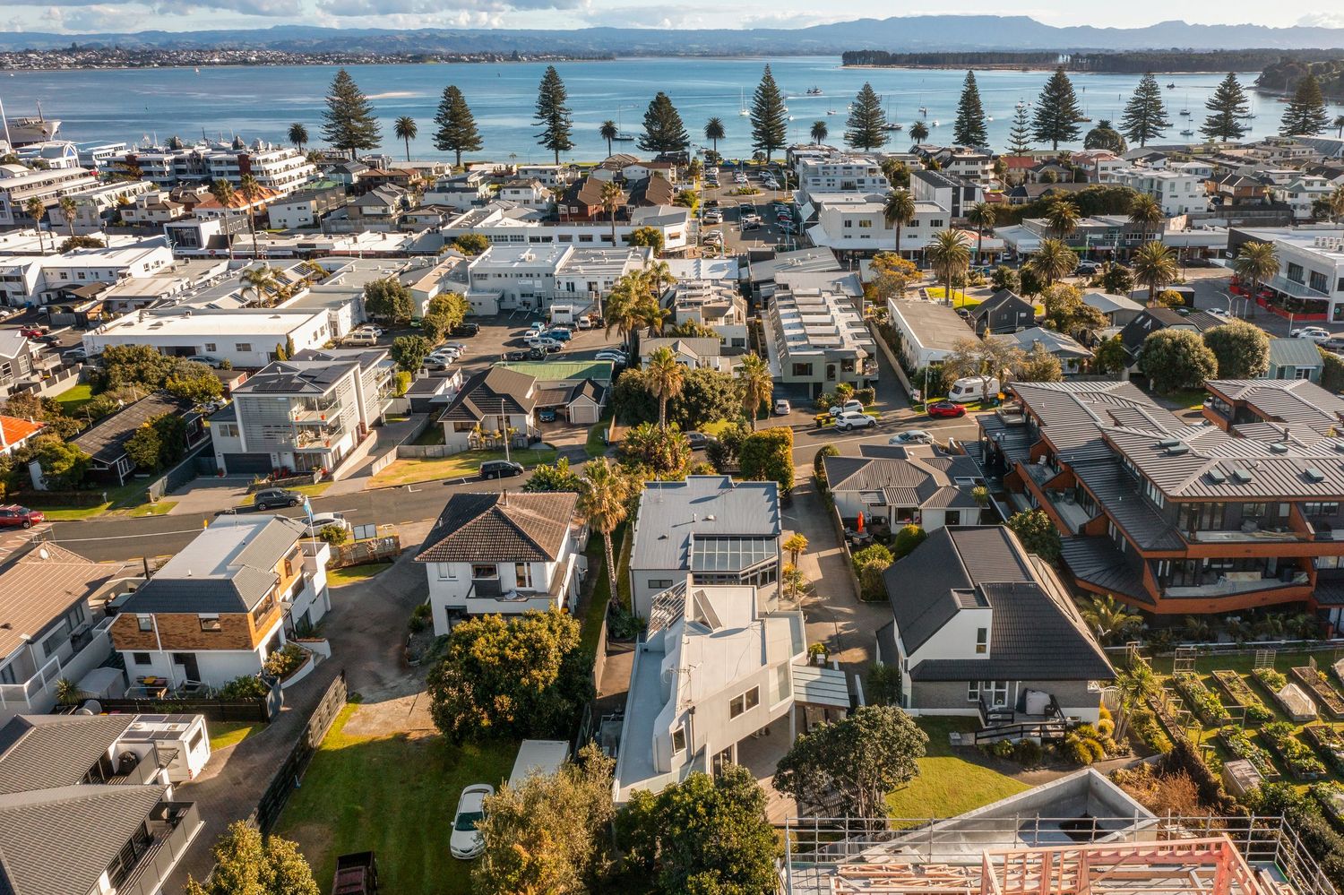 Panoramic coastal vista showing beachfront homes and community along the shoreline.