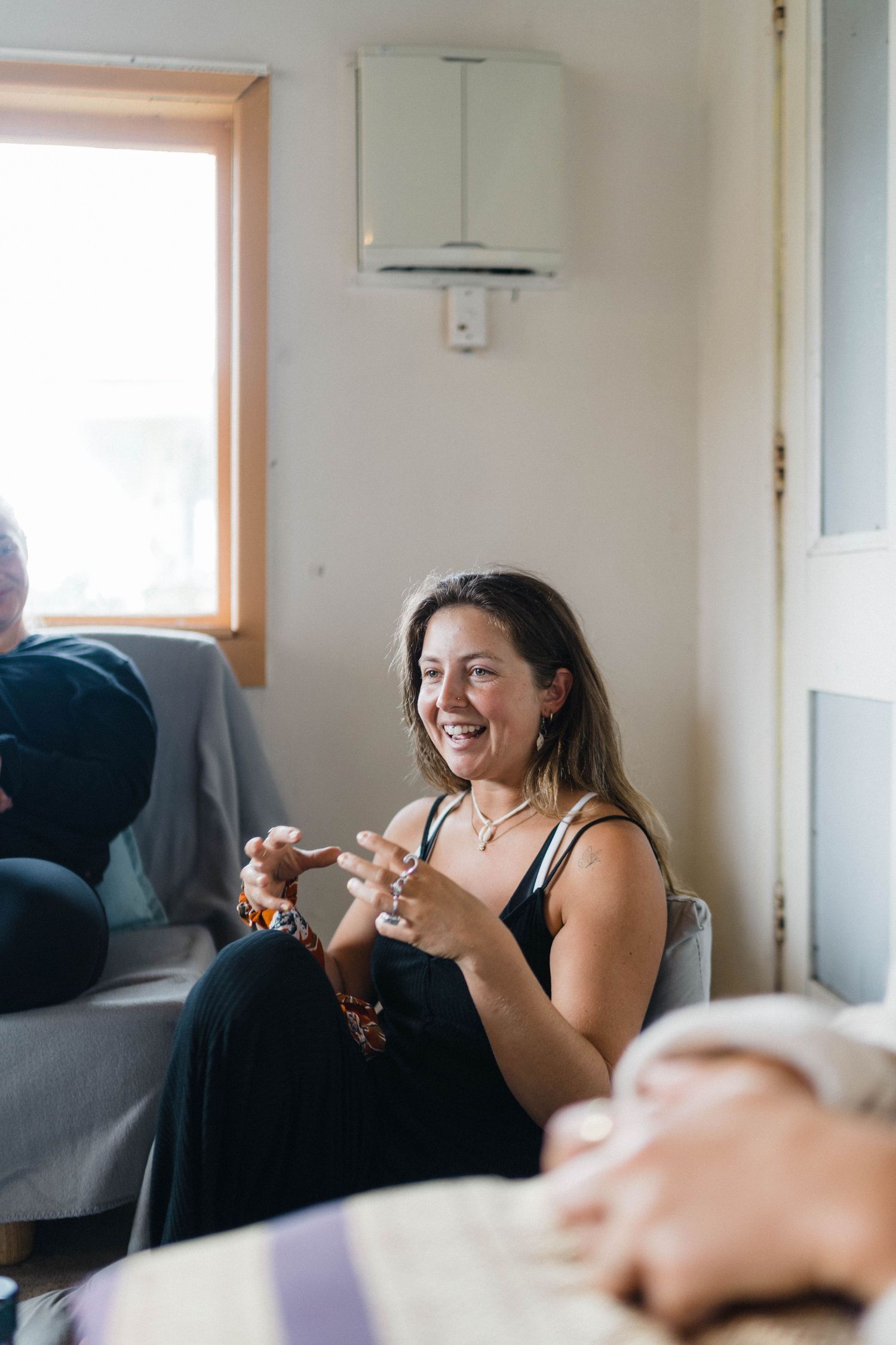 Casual gathering in living room with relaxed social atmosphere.
