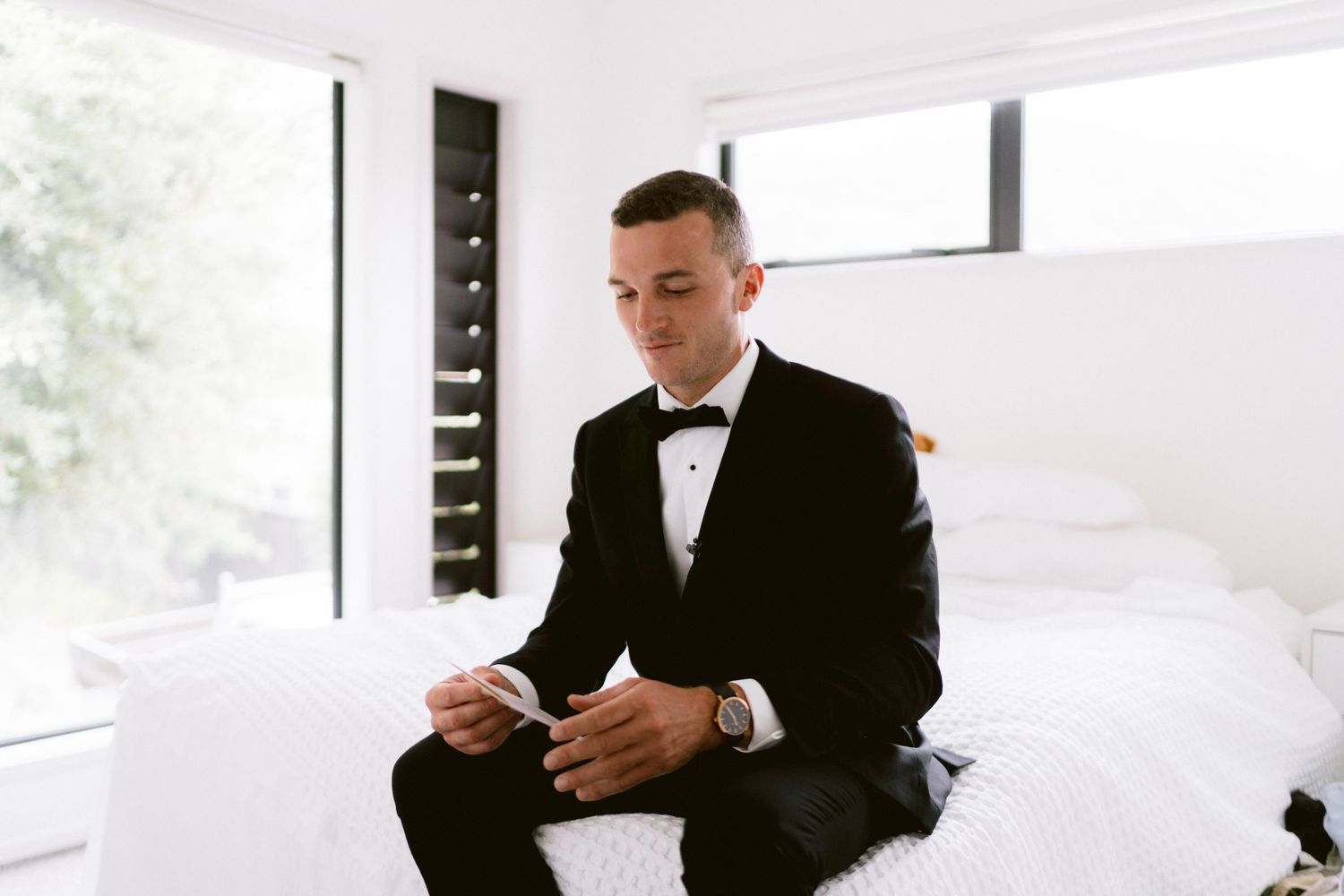 A row of elegant wedding photos showing emotional moments reading personal letters in formal attire.