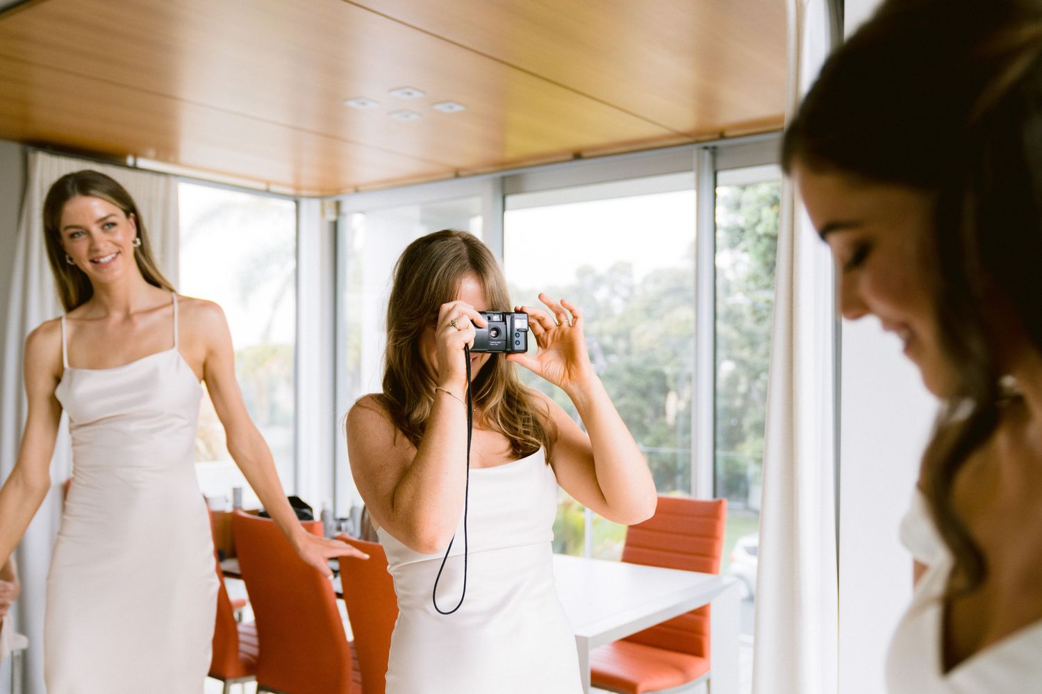 Candid getting-ready moments captured in sequence at a bridal preparation.