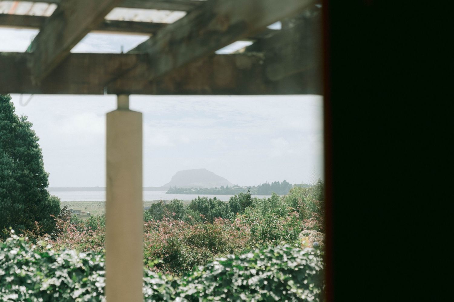 Elegant wedding venue space with floor-to-ceiling windows and natural lighting.