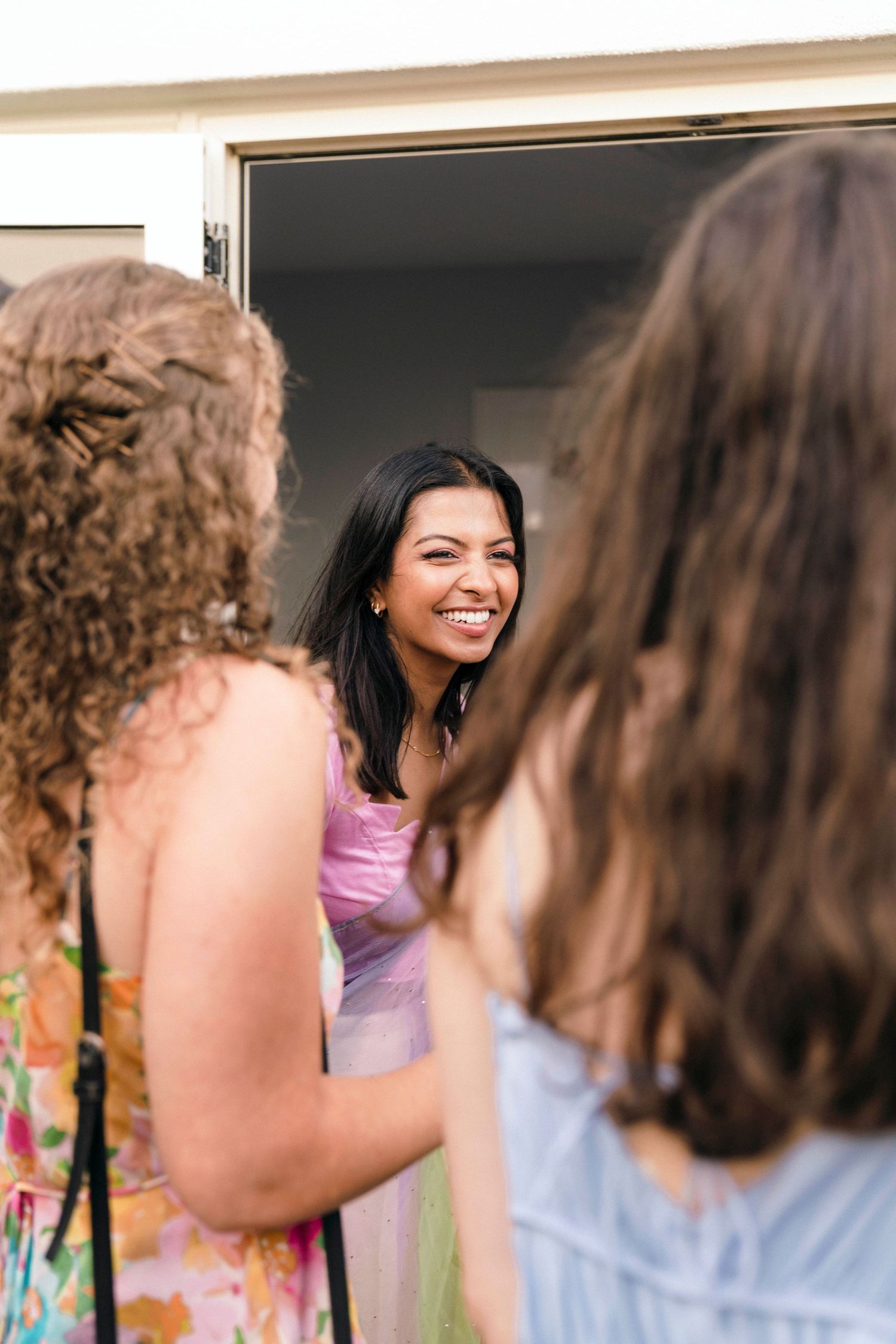 A cheerful moment shared between friends in a bright indoor setting.