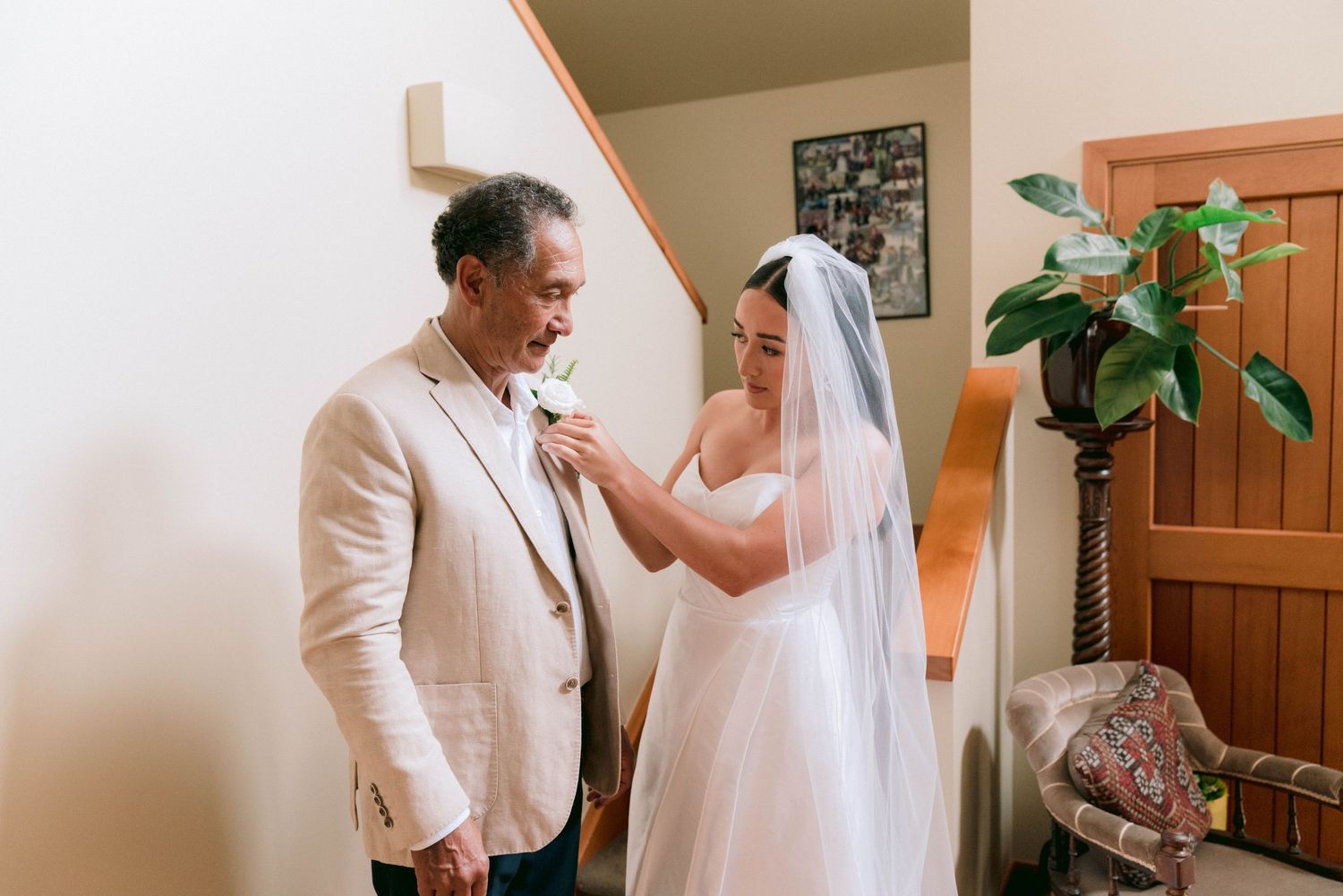 Intimate wedding preparation moments in a warmly lit indoor setting.