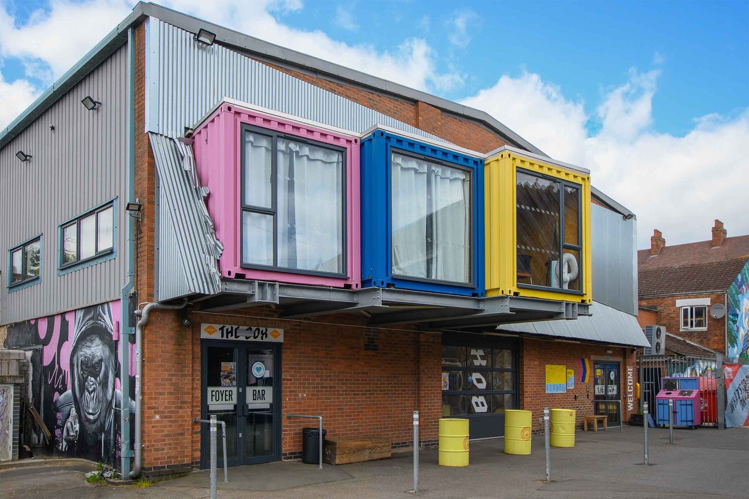 The Box wedding venue at Fargo Village. Complete with container-style extensions in pink, blue and yellow protruding from the second floor.