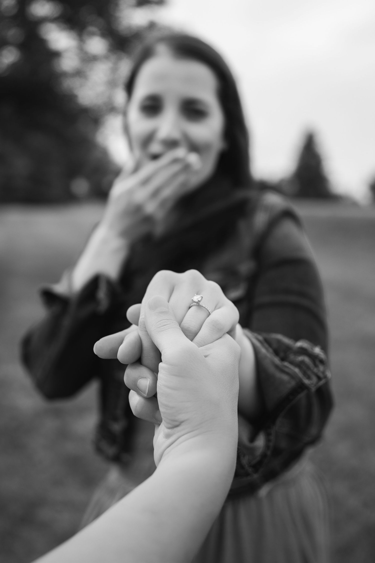 Series of black and white photos showing hands reaching out and clasping together.