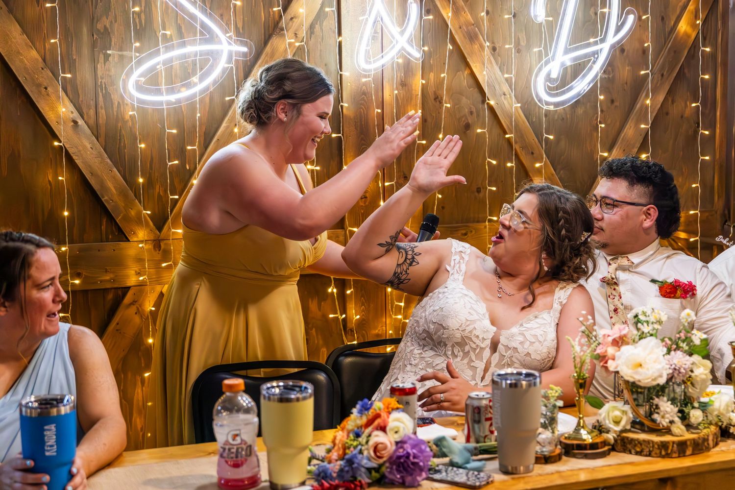 Reception venue decorated with twinkling string lights and elegant table settings.
