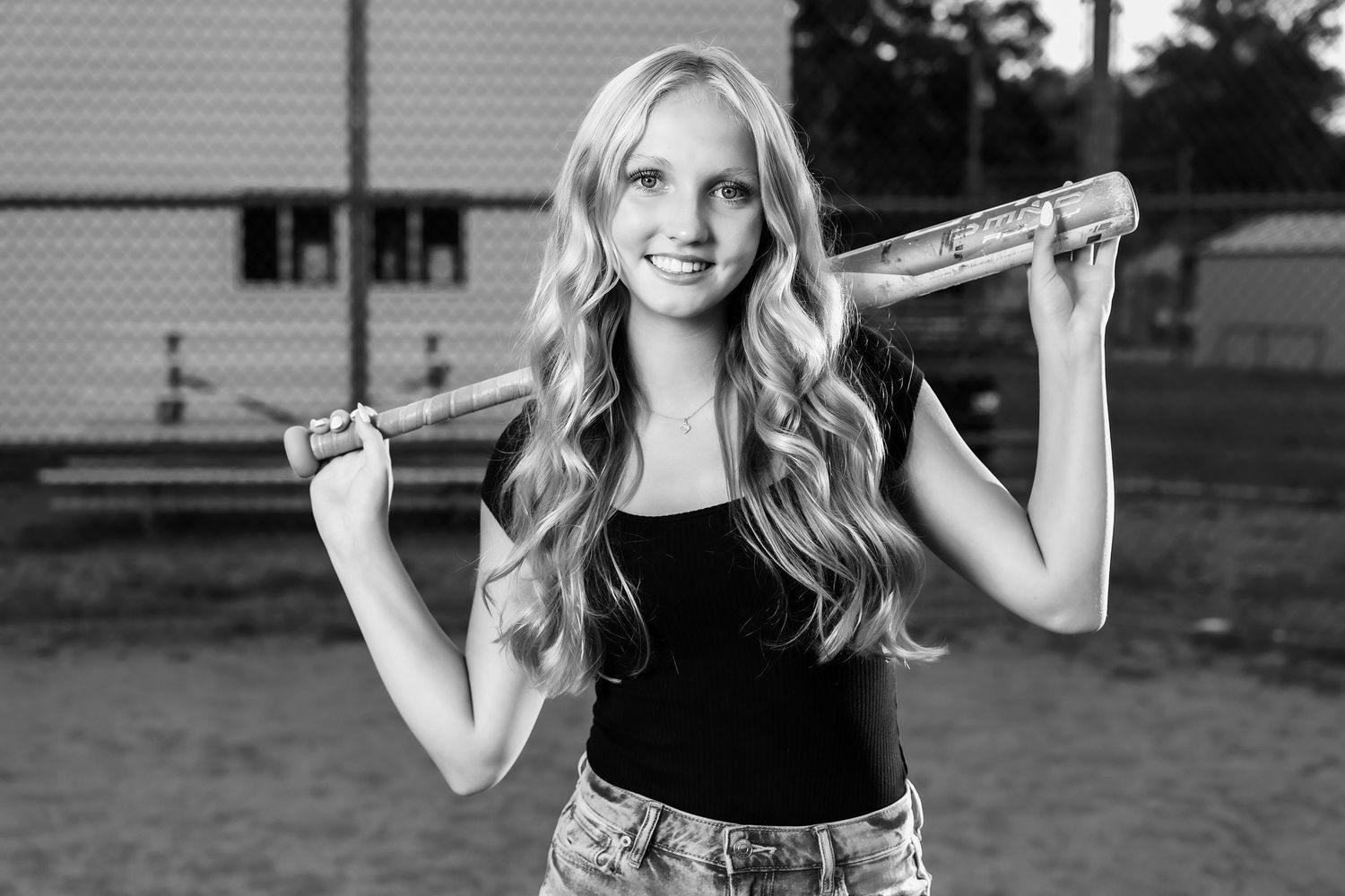 Black and white portrait series showing athletic poses with tennis racket.