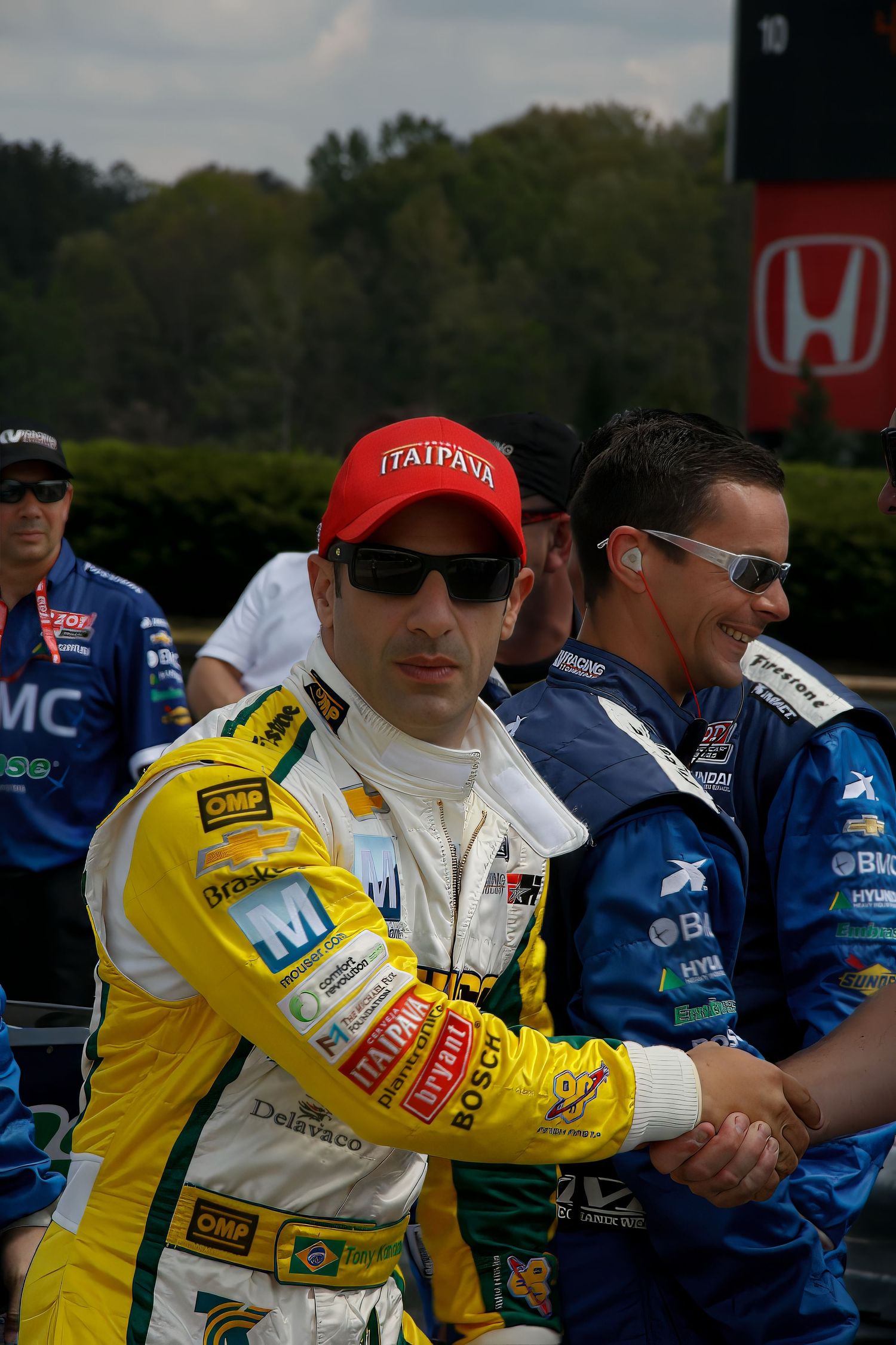 Candid portrait of Helio at Barber Motorsports Park, Birmingham, AL—Formula One energy, racing vibe, paparazzi-style photo.