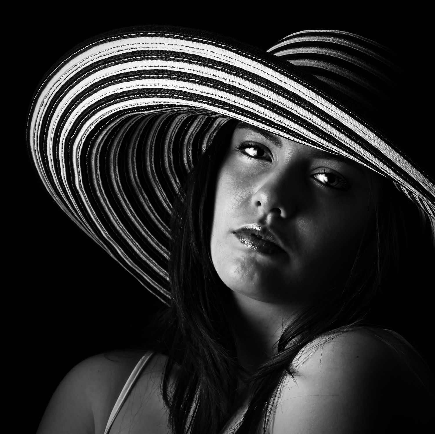 Dramatic cinematic black and white portrait of a lady in a hat, Photography by Rachel