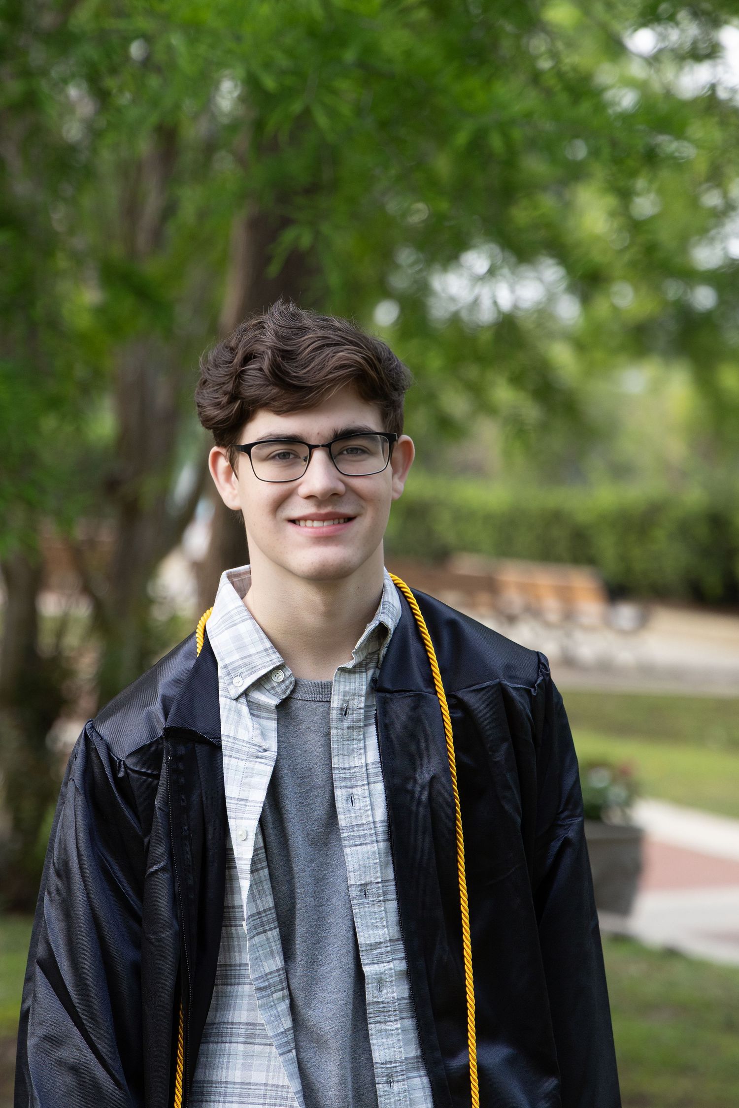 Class of 2025, Sr. Portrait, Cap & Gown, in the park at Milton Riverwalk, Santa Rosa County, FL, Photography by Rachel.