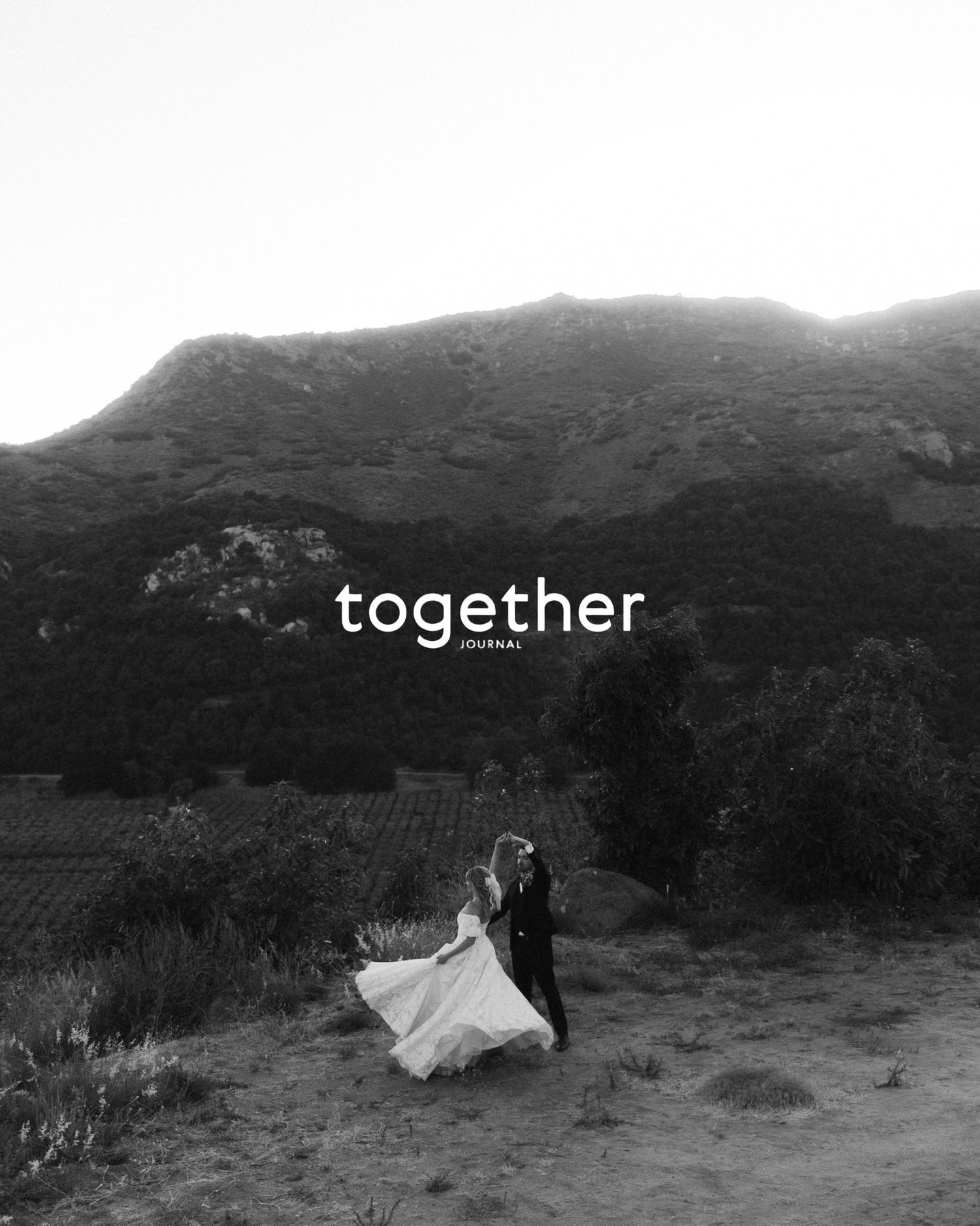 Black and white wedding photo with 'together' text against mountain silhouette.