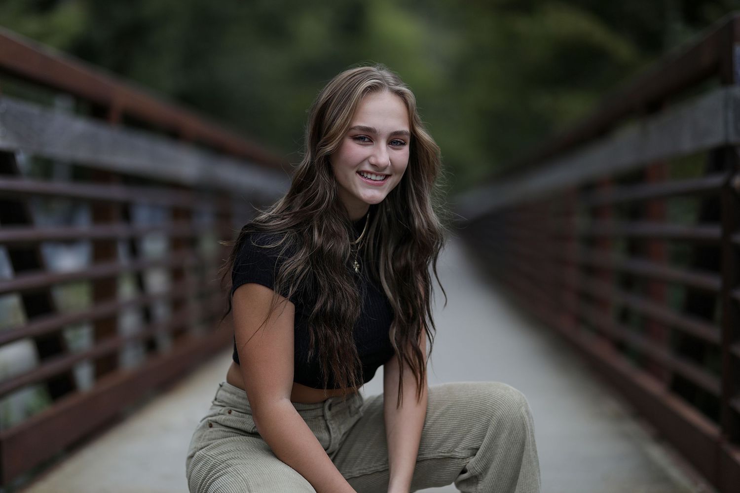 Series of connected photos showing a person on a wooden bridge outdoors in casual summer attire.
