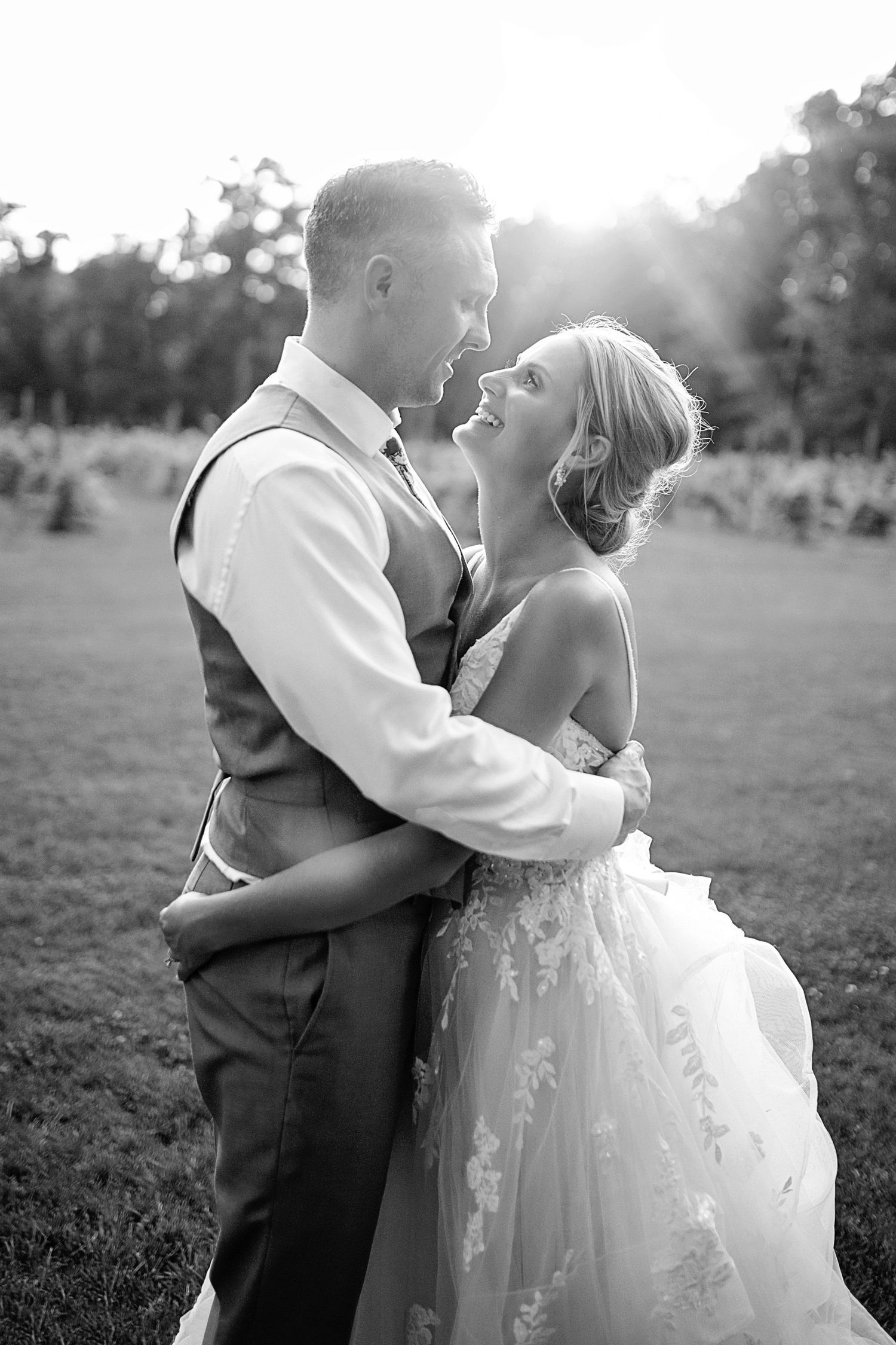 Romantic black and white portrait of newlyweds embracing during sunset. Cleveland wedding photographer
