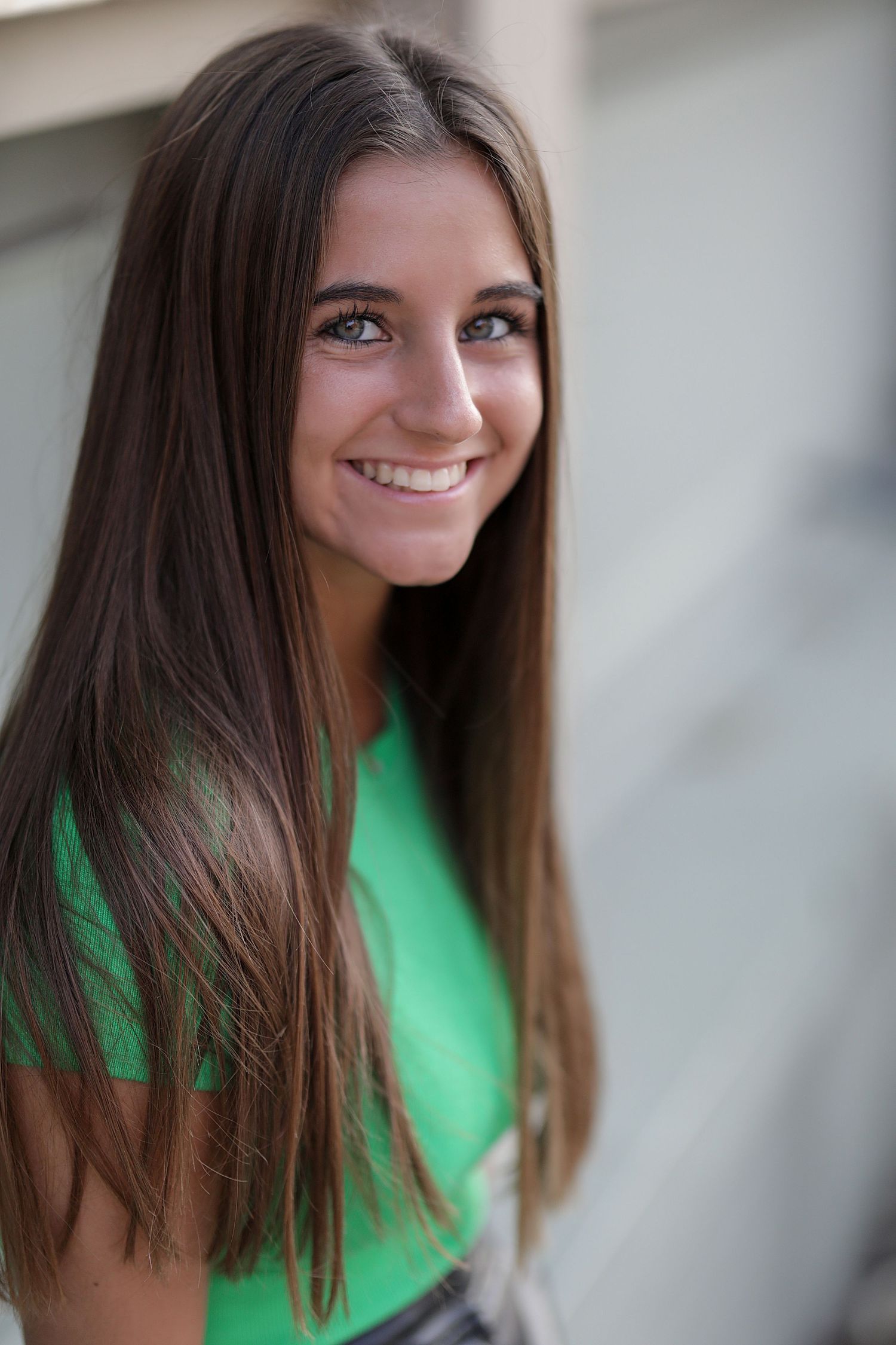 Portrait series showing a person in a bright green top with long brown hair against a light background.