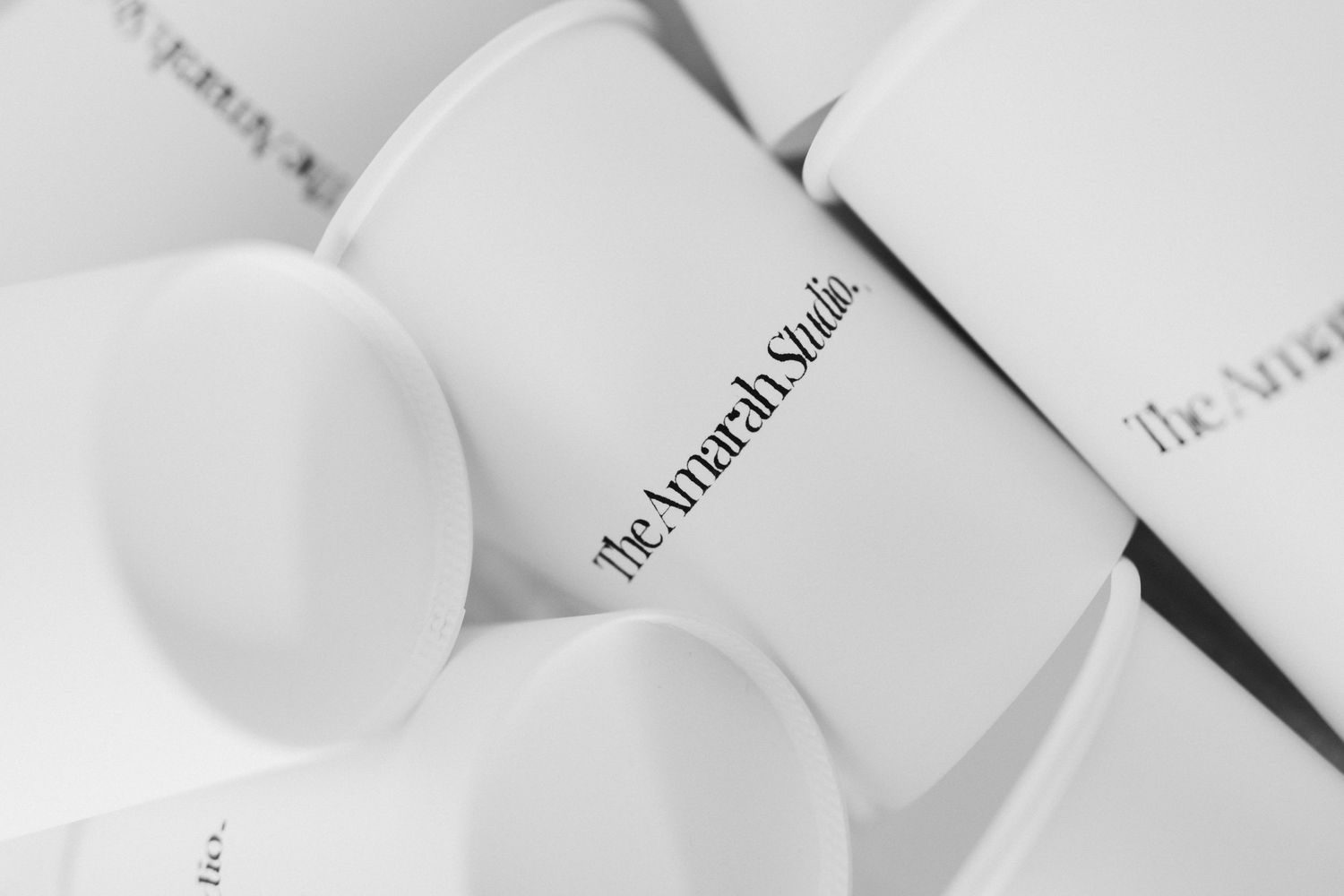 Clean white studio setup with minimalist lighting equipment.