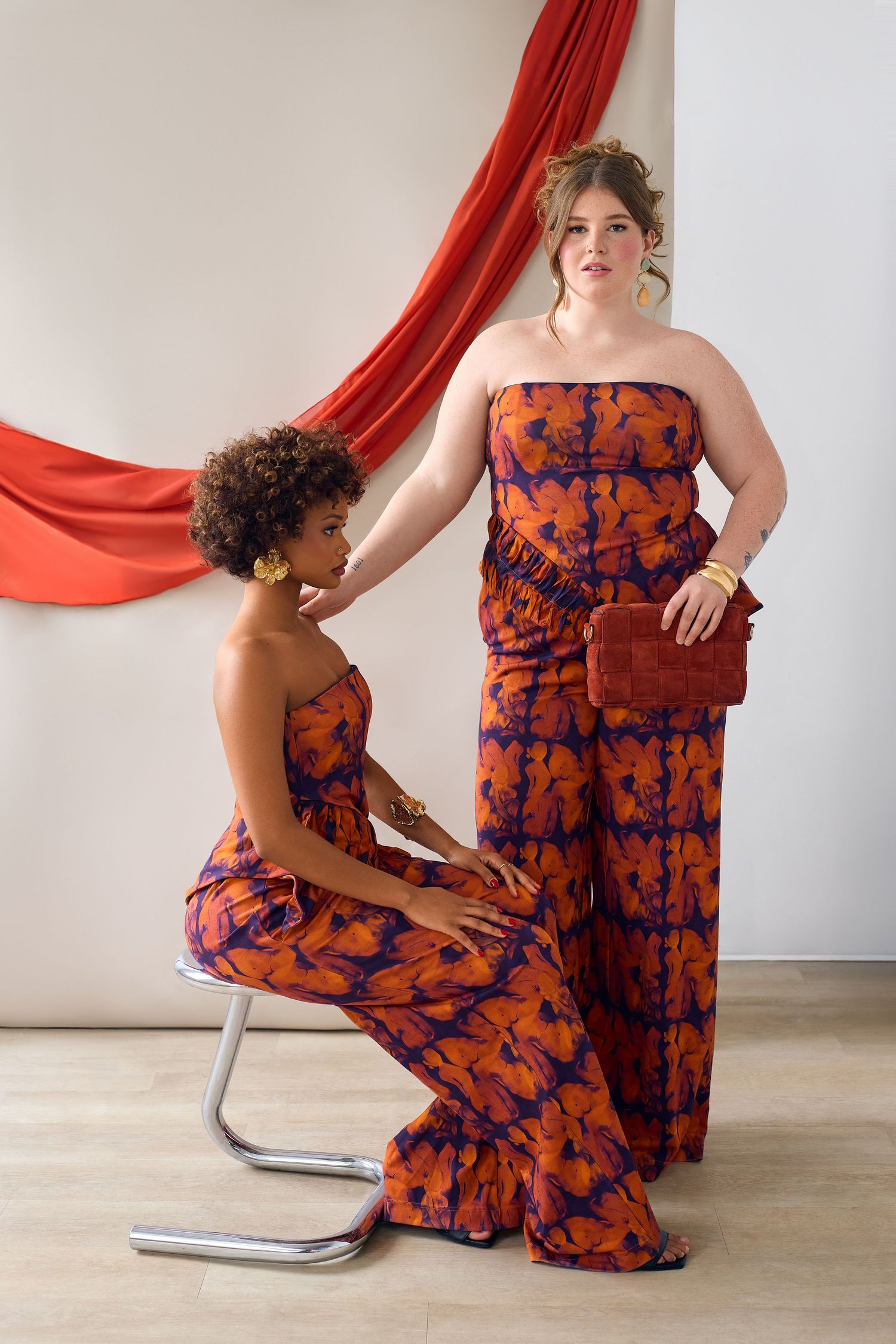 Fashion photoshoot featuring orange and blue patterned palazzo pants with coordinating top.