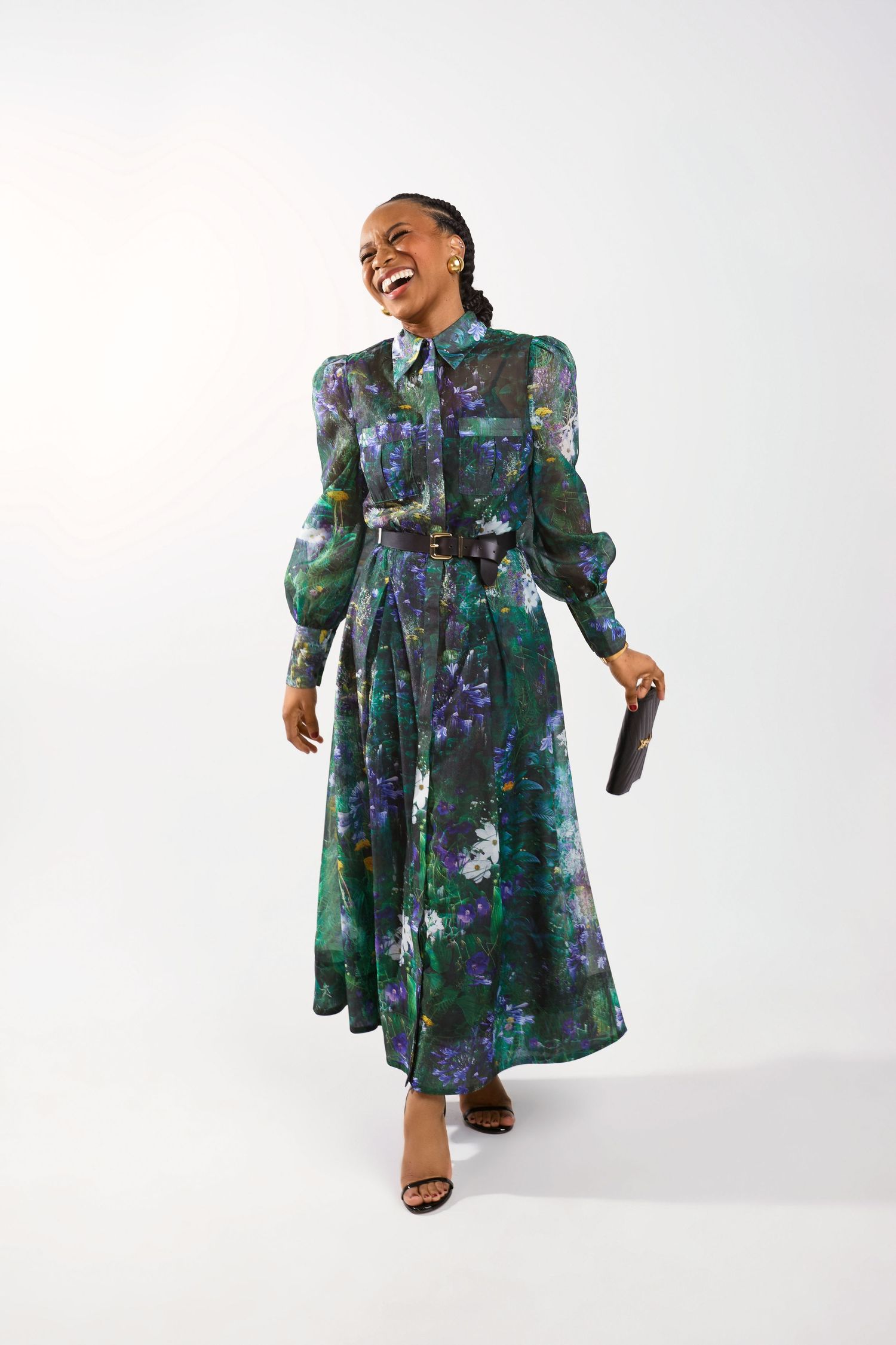 Dynamic movement shots in emerald green floral dress showing various angles.