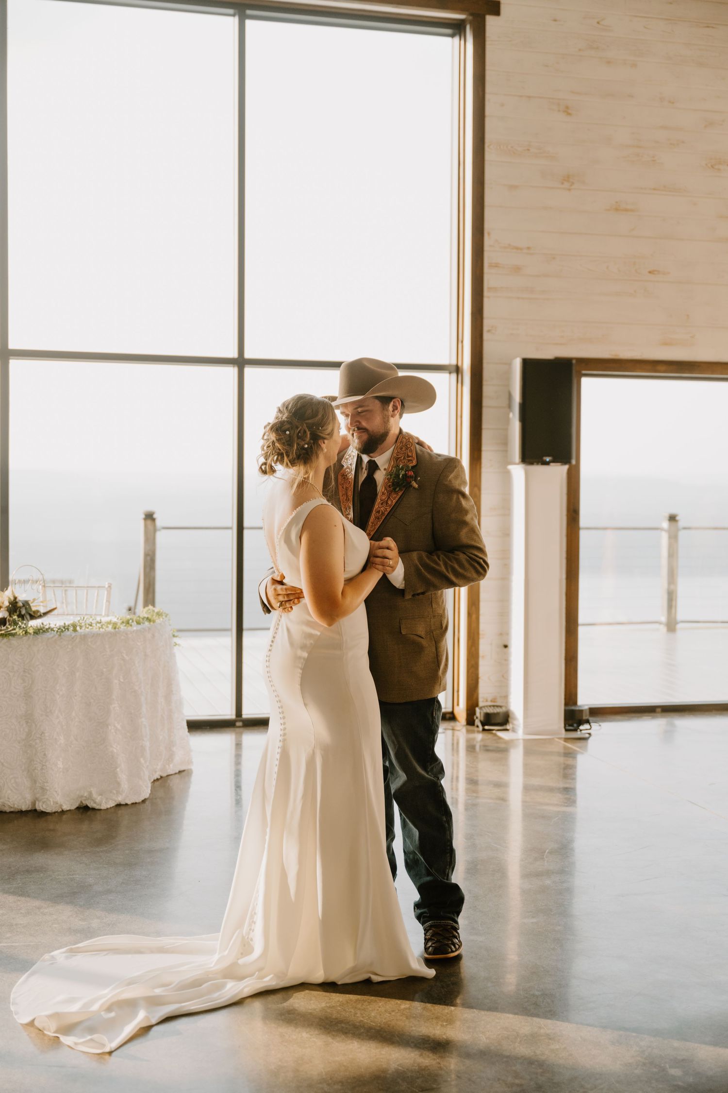 Intimate Western Wedding Couple Reception at the Barn at Greers Ferry Wedding Venue Near a Lake in Arkansas