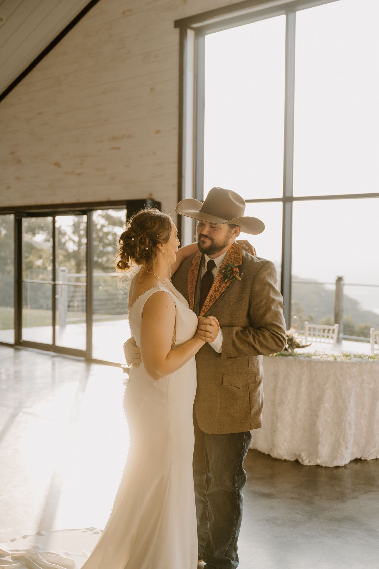 Intimate Western Wedding Couple Reception at the Barn at Greers Ferry Wedding Venue Near a Lake in Arkansas