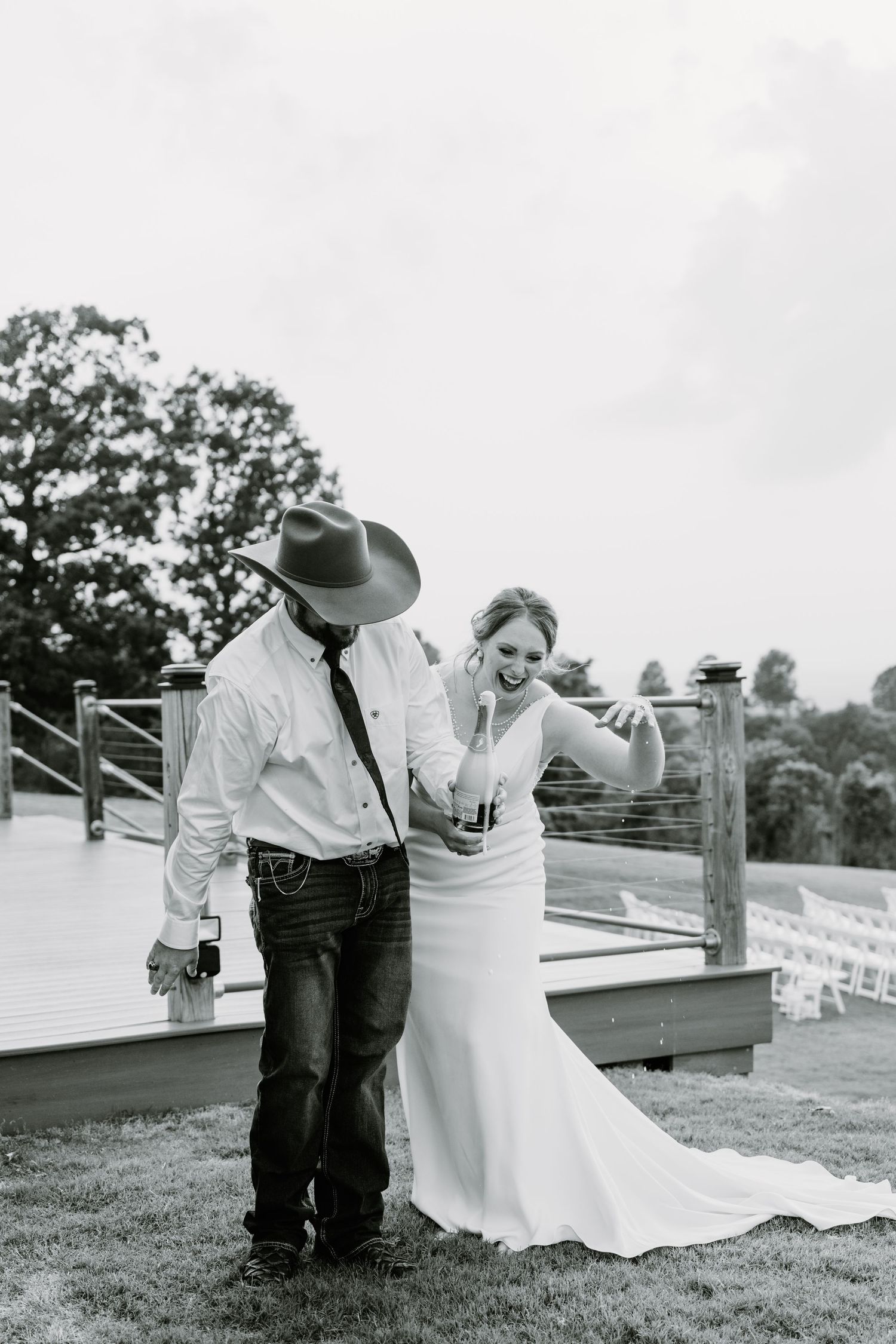 Intimate Western Wedding Couple Reception at the Barn at Greers Ferry Wedding Venue Near a Lake in Arkansas