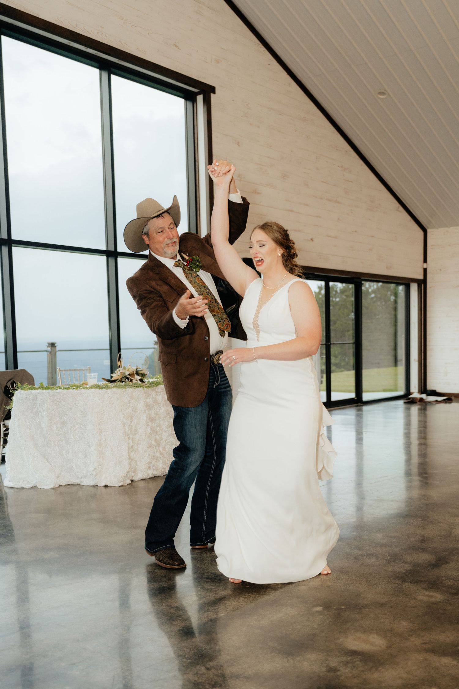 Intimate Western Wedding Couple Reception at the Barn at Greers Ferry Wedding Venue Near a Lake in Arkansas