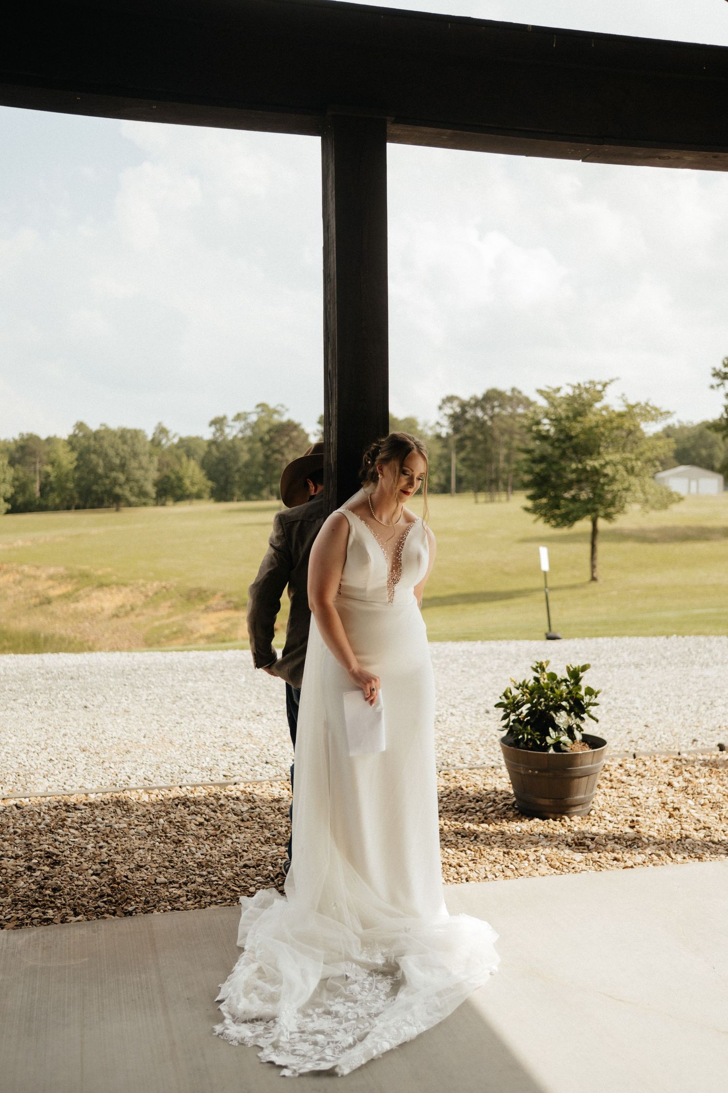 Couple First Look at the Barn at Greers Ferry Wedding Venue Near a Lake in Arkansas