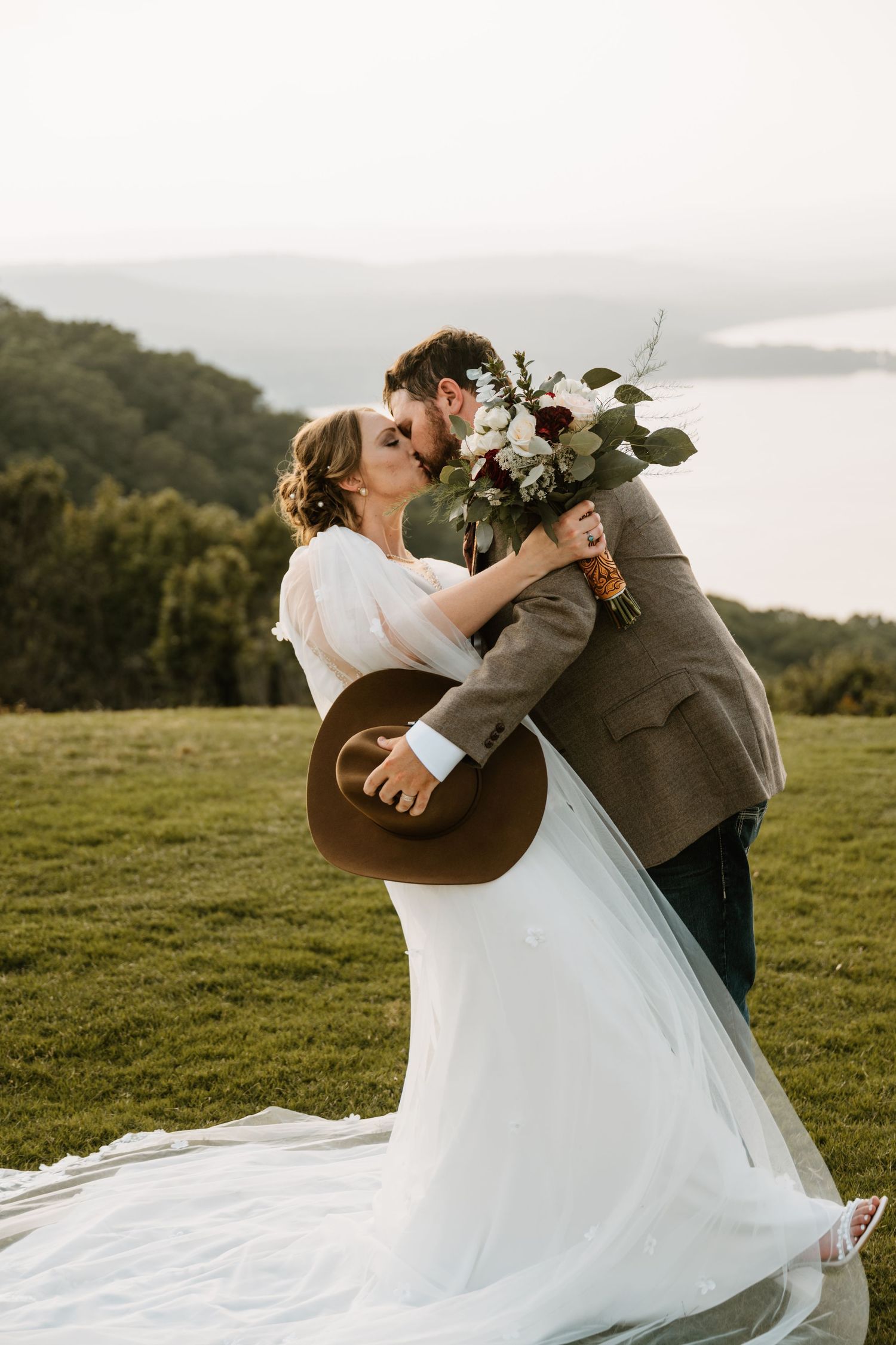 Intimate Western Wedding Couple Portraits at the Barn at Greers Ferry Wedding Venue Near a Lake in Arkansas