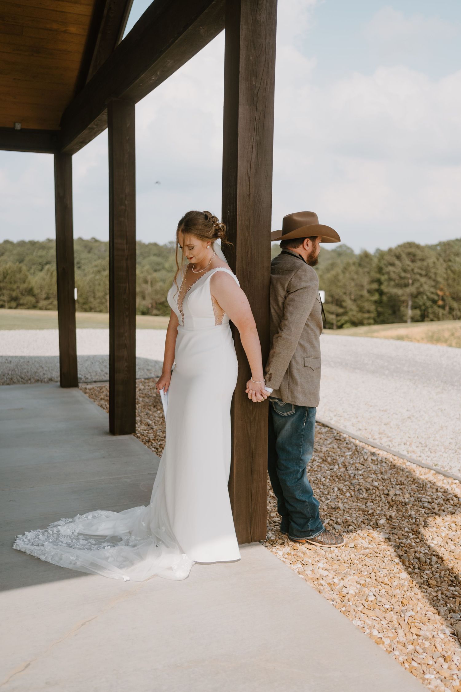Couple First Look at the Barn at Greers Ferry Wedding Venue Near a Lake in Arkansas