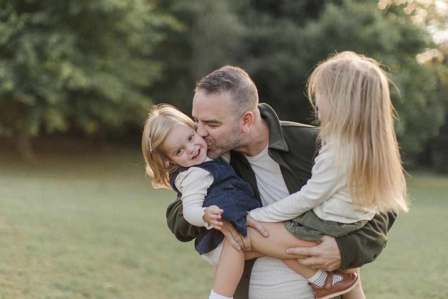 A tender family moment captured outdoors in natural lighting - Atlanta Family Photos