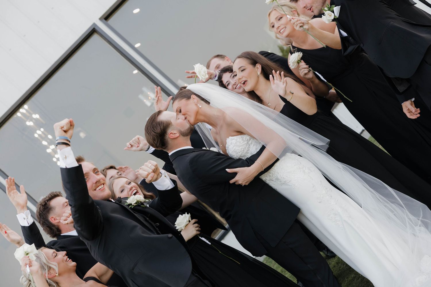 Wedding couple shares an intimate dip while dancing together on their special day at an elegant reception.