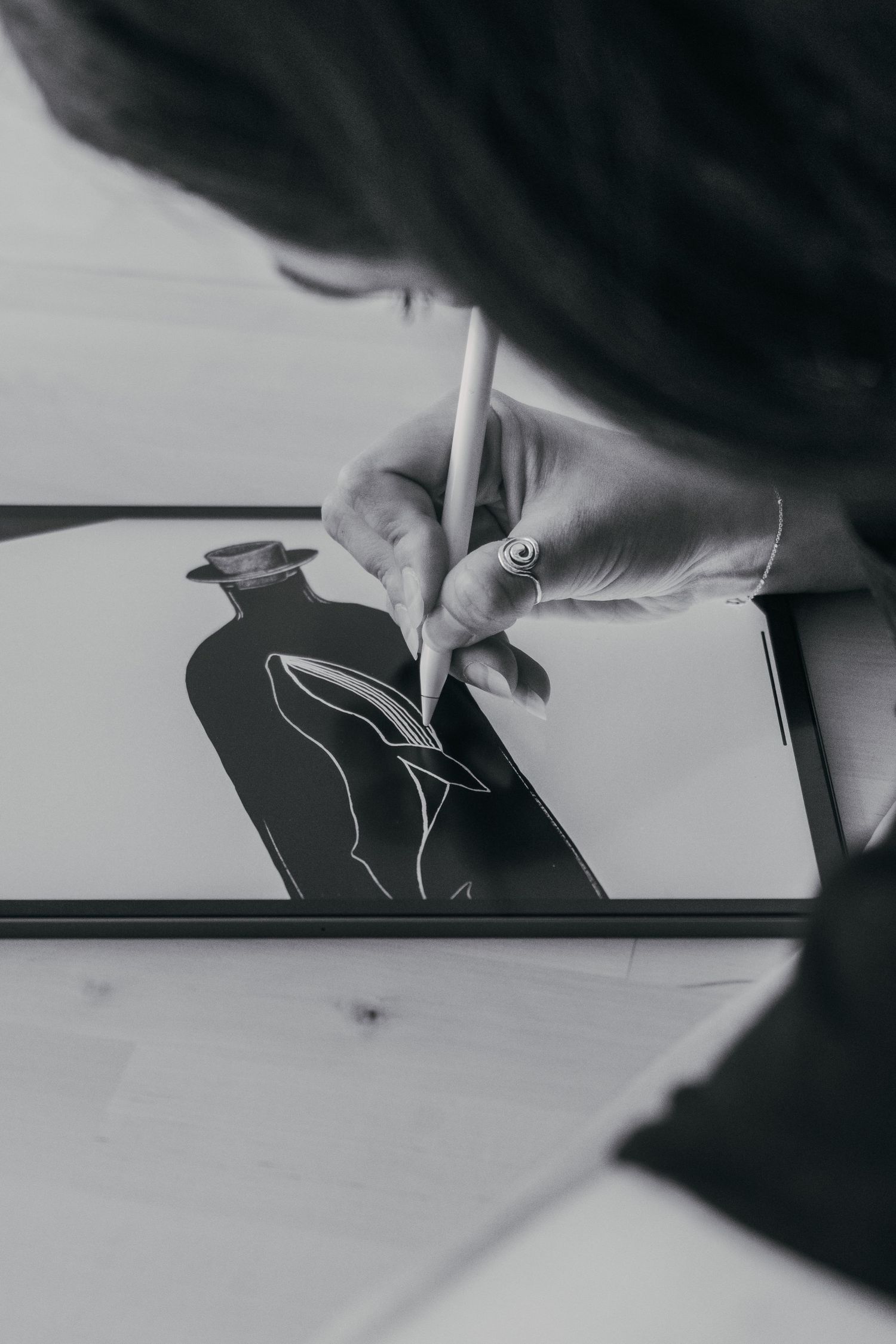 Brand Photography of Hand drawing minimalist line art of hands on paper in black and white monochrome style.