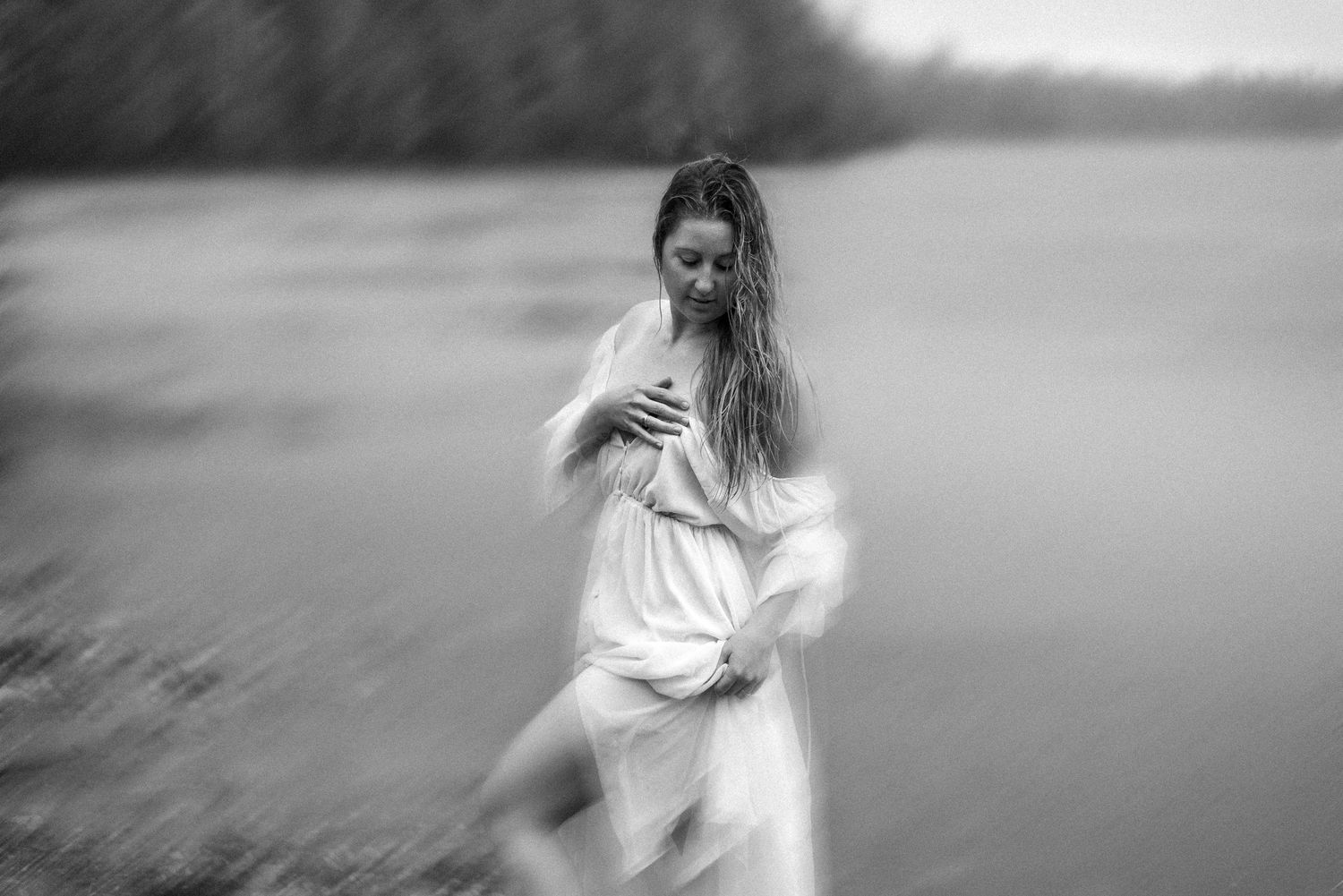 Black and white photo series showing a figure in white dress moving through a misty outdoor setting at dusk.