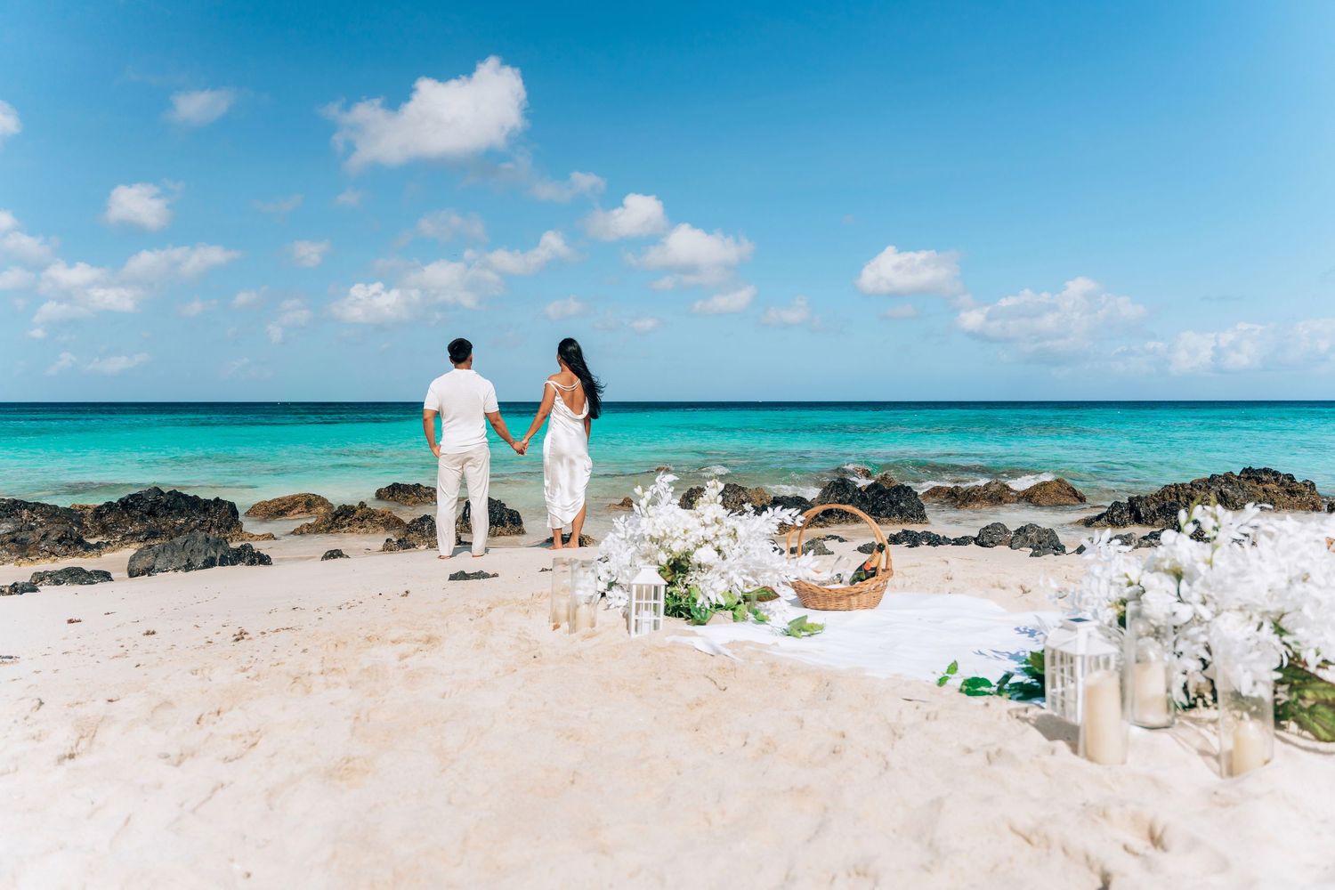 Row of beach wedding images showing white-draped chairs, ceremony setups, and turquoise ocean views at a tropical destination.